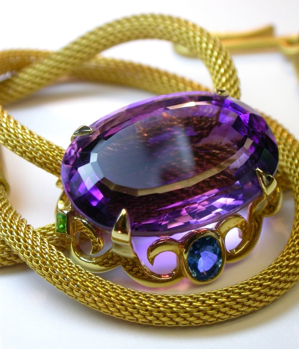 A beautiful amethyst is the focus of this yellow gold necklace from my archives. In among the scrolls of the mount, there are also equally lovely aquamarines and tsavorite garnets.
.
.
#amethyst #amethysts #aquamarine #aquamarines #tsavoritegarnet #t