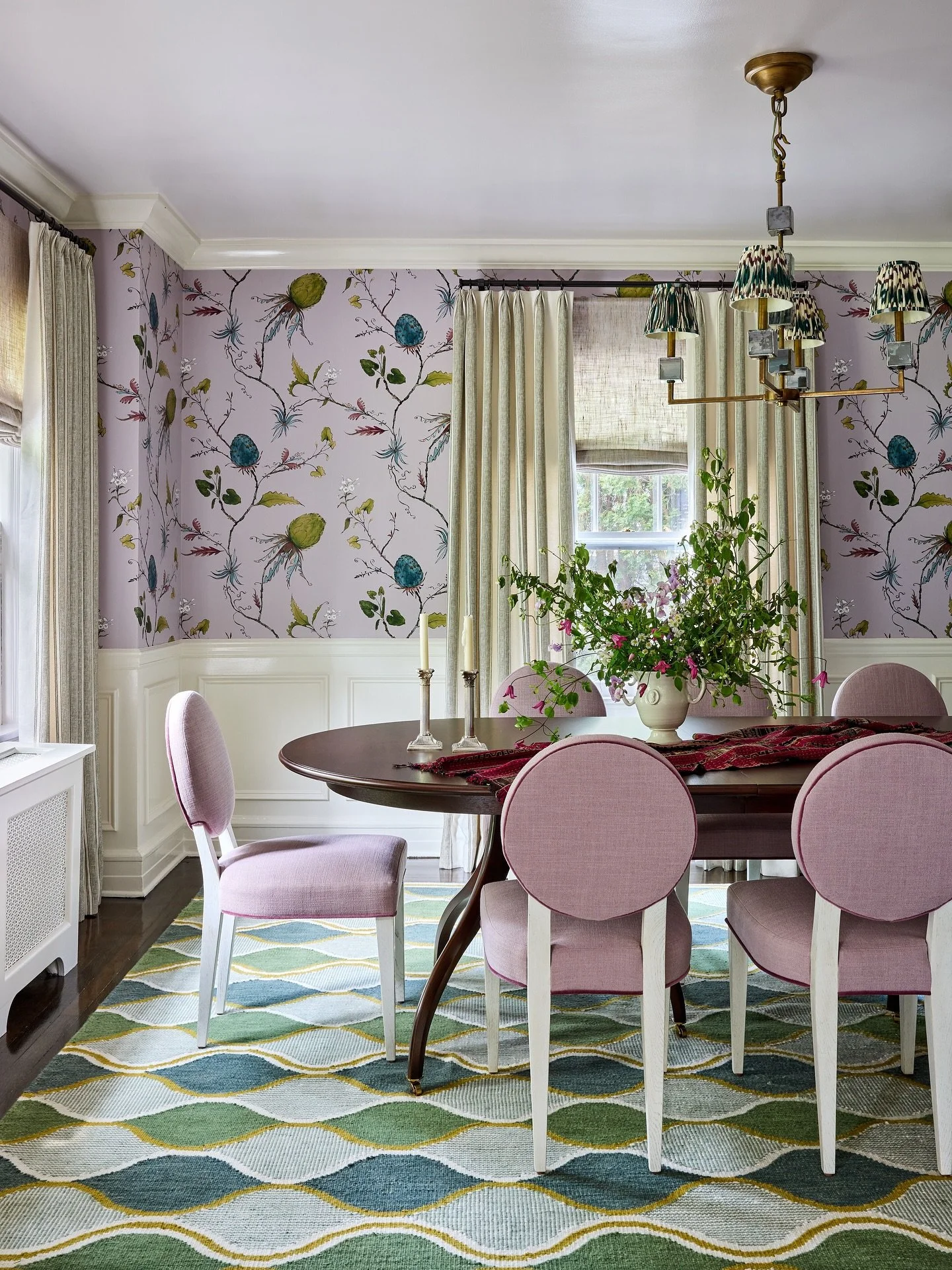 She&rsquo;s all ready for a dinner party! This client requested California cool but NY colonial appropriate. A whimsical but sophisticated wallpaper, striped linen draperies and colorful flat weave mixed with the traditional lines of the dining table