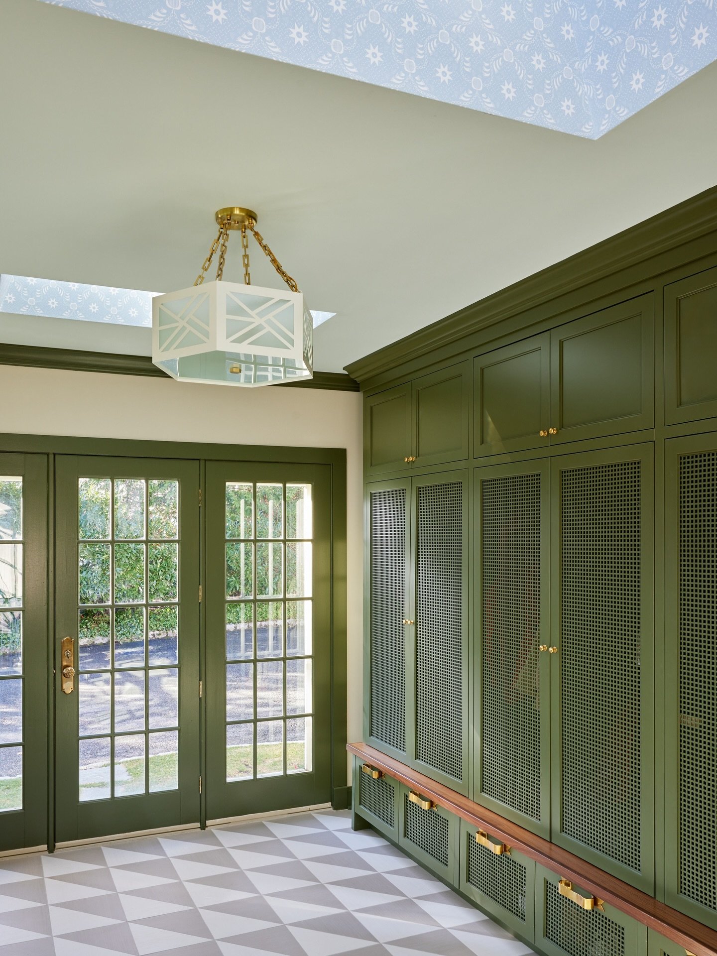 In Ridgewood we have a lot of old homes that have been added on to over the years. This room used to be a sunroom but the family of 6 was better served by a mudroom. With all of the light it makes a very cheery place to walk in and take off your shoe