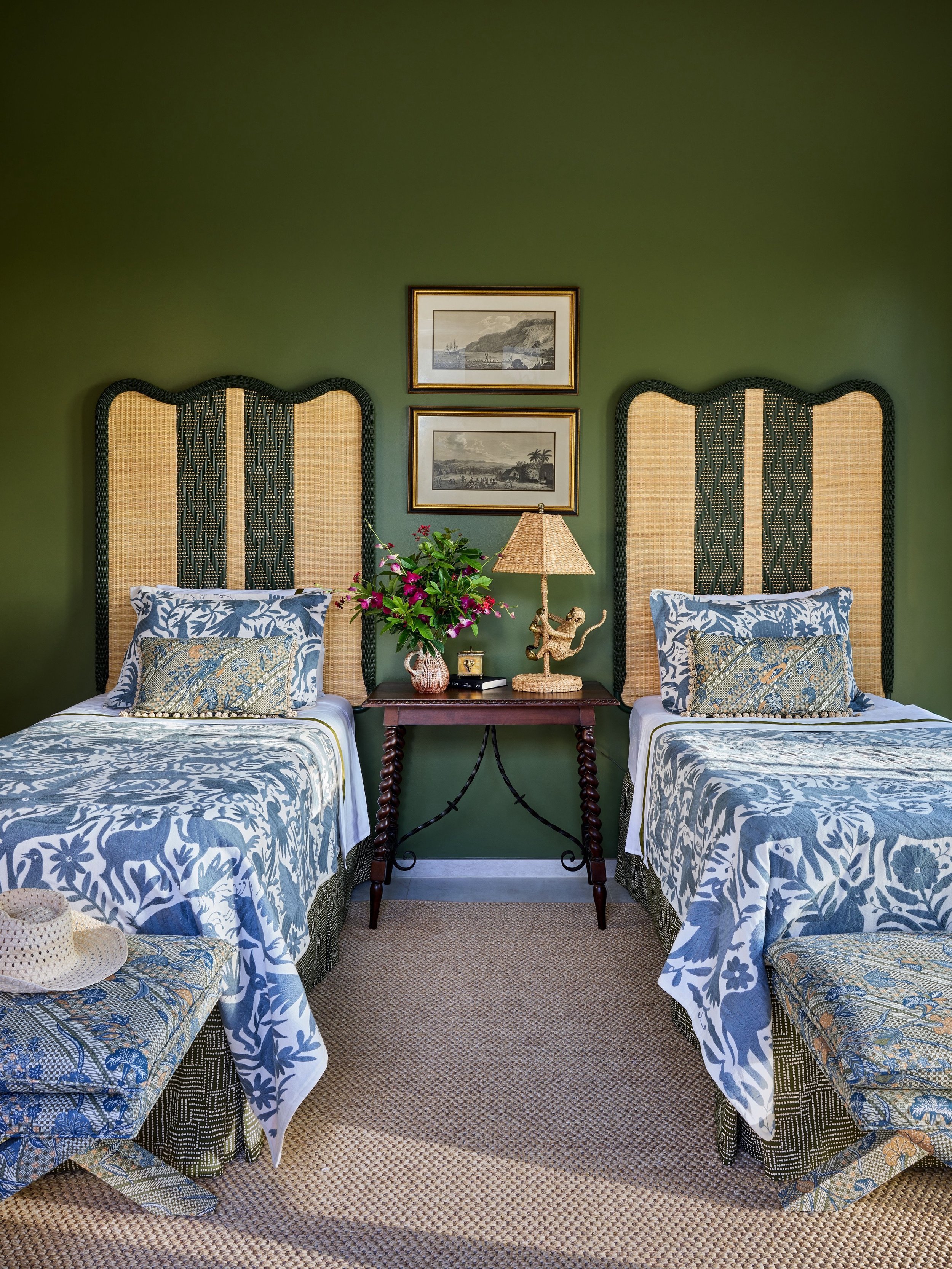One of the guest bedrooms in our Turks project features custom rattan headboards made in France and an antique table. All of the rooms needed texture and patina. The fabric on the ottomans is one of my favorites. Sign up for our newsletter at the lin