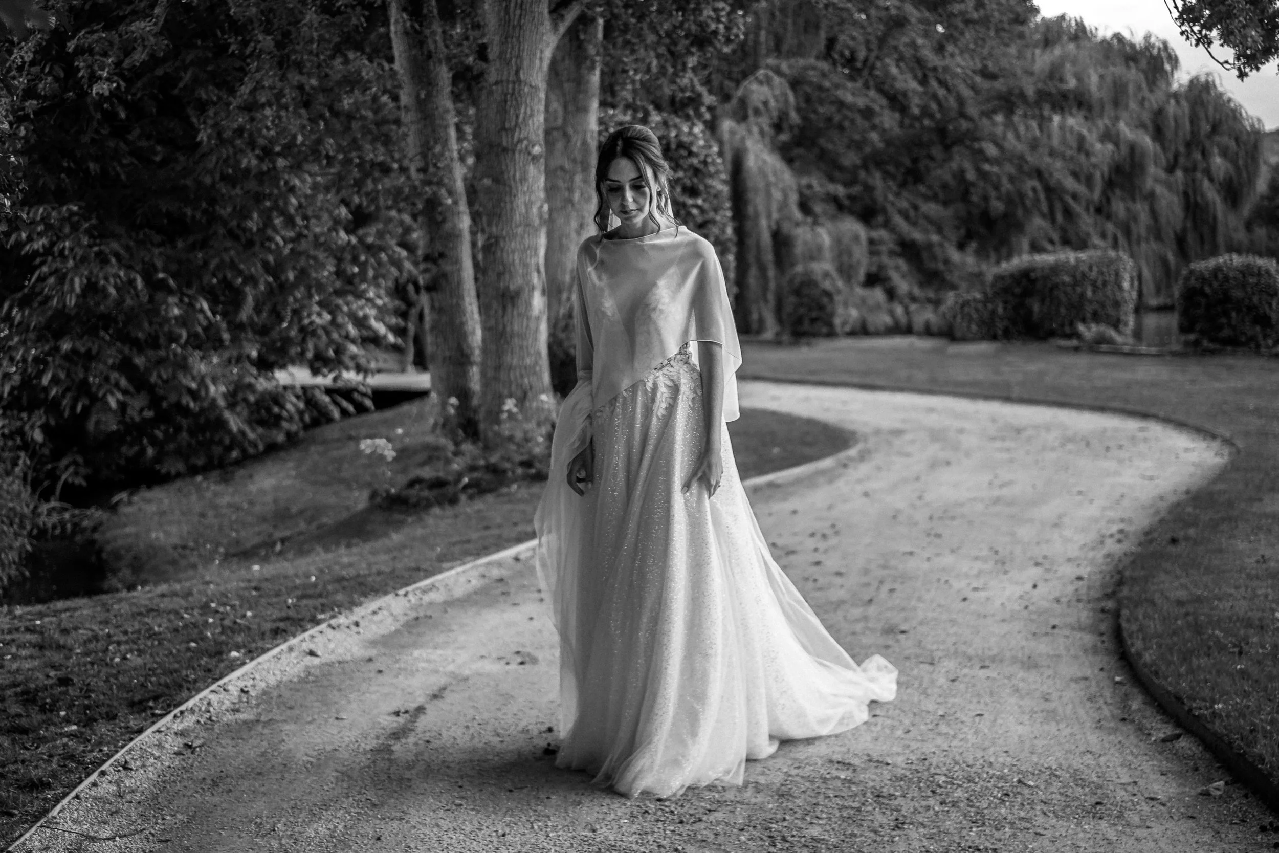Bride walking down a path in Paris