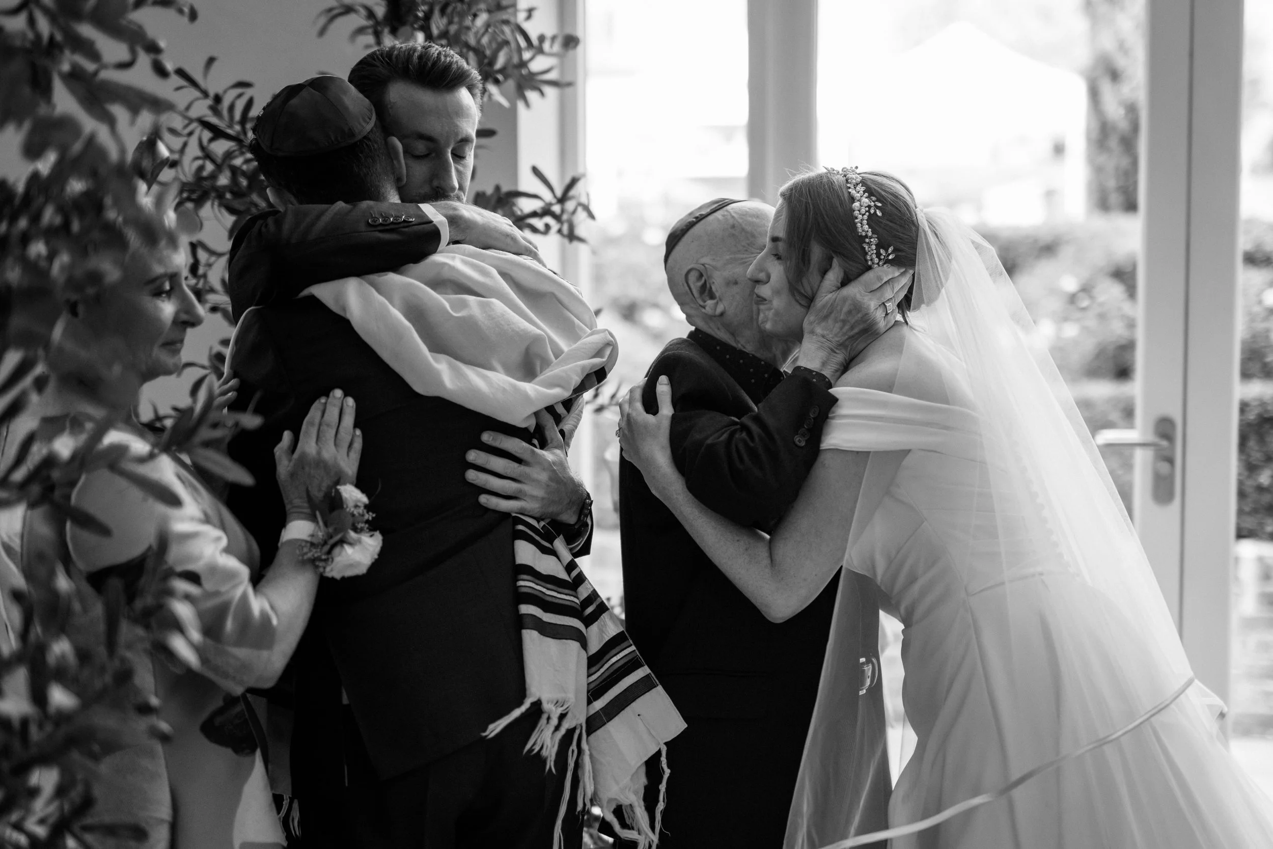 Hugs all round after the jewish wedding