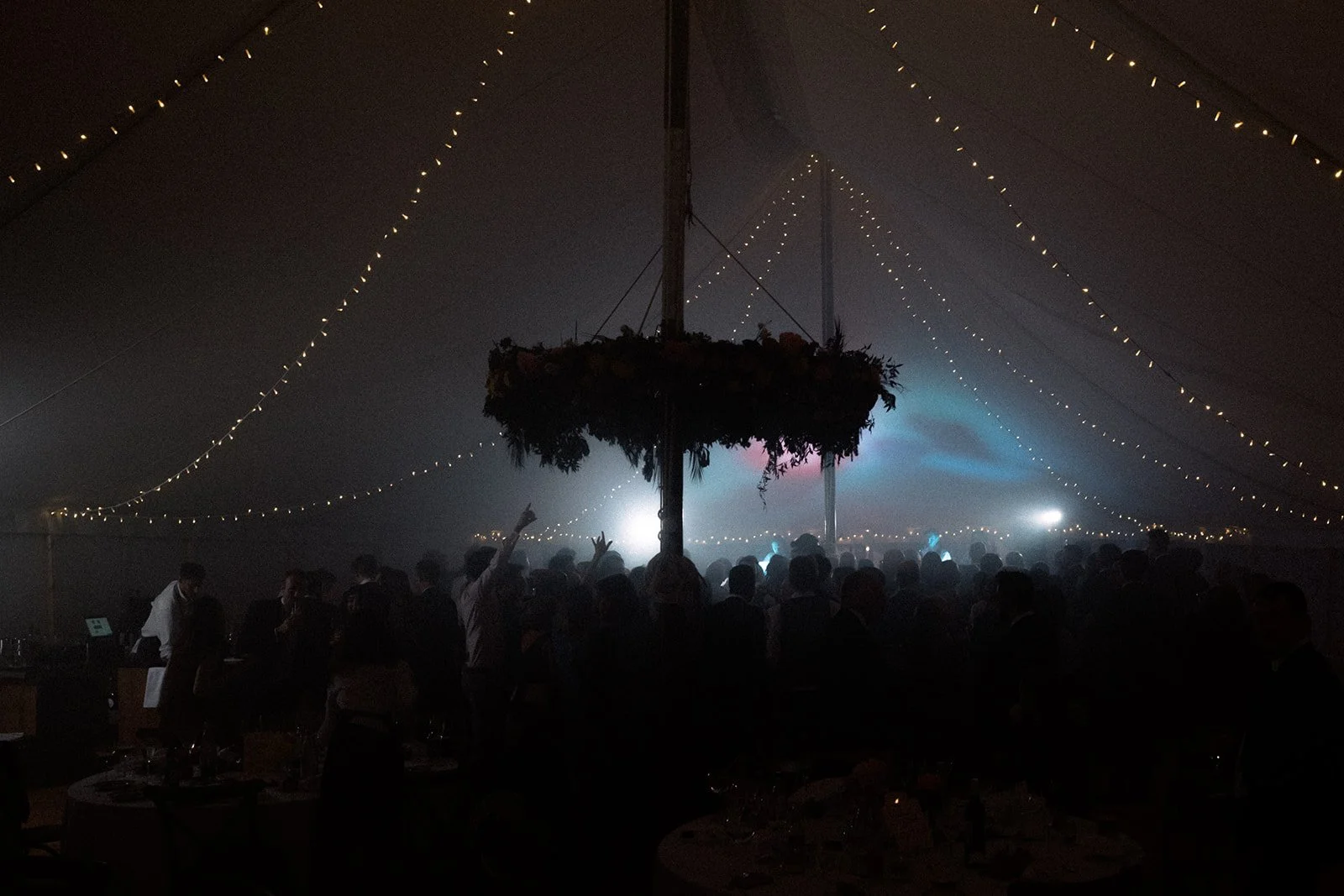 A garden party weddings turns into a festival style celebration at the end of the night as a band plays late into the night.
