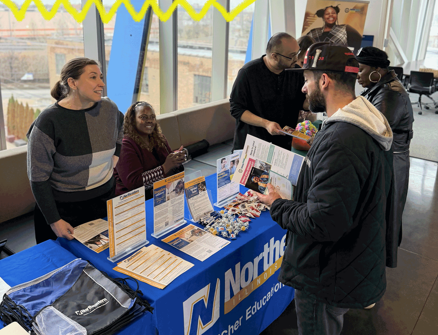 Northeastern Illinois representative discusses GYO-IL programming with a potential teacher candidate.
