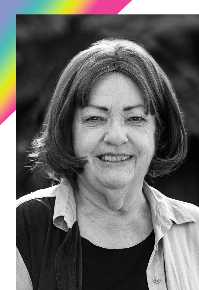 Black-and-white headshot of Dr. Sally Black with a rainbow triangle corner frame behind the photo.