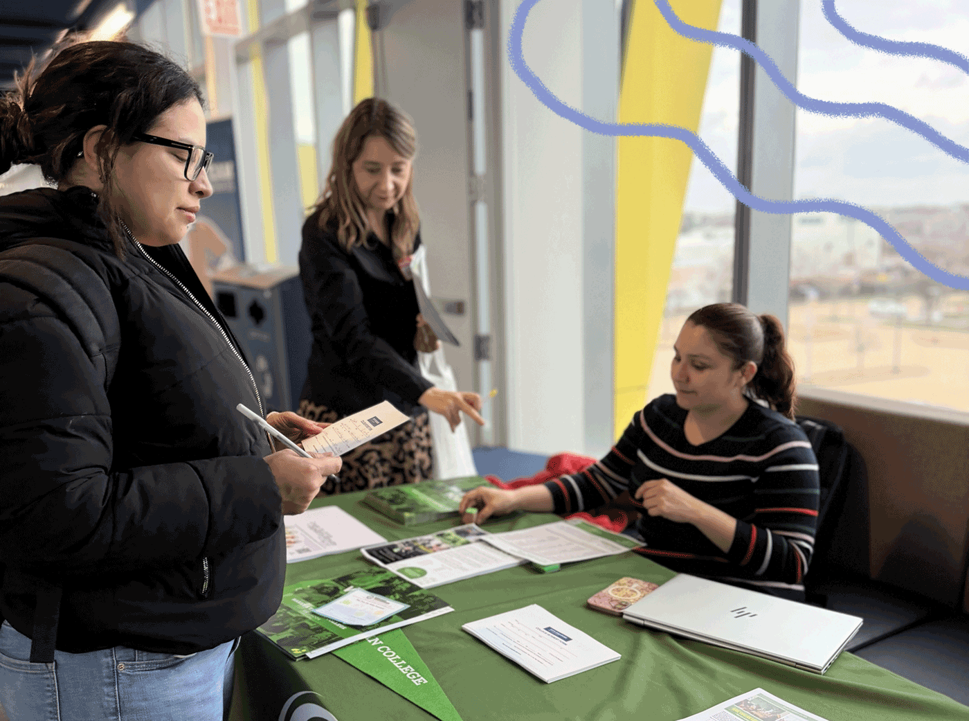 Potential GYO-IL Candidate chatting with a representative from Truman College.