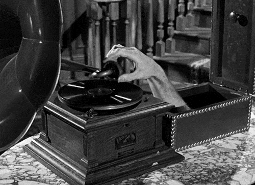 addams-family-thing-record-player-music-turntable.gif