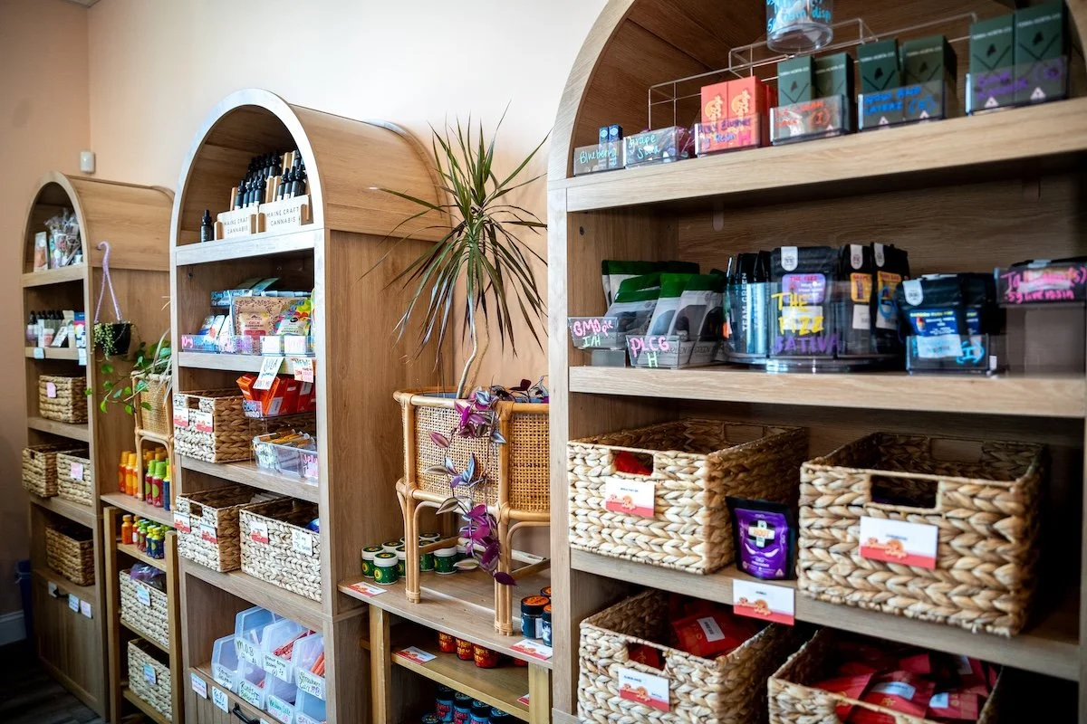 Shelves stocked with premium medical cannabis products at Beach Boys Cannabis Co. in South Portland, Maine. Browse a wide selection of Maine-grown flower, prerolls, vape cartridges, concentrates, live rosin, edibles, tinctures, CBD products, and well