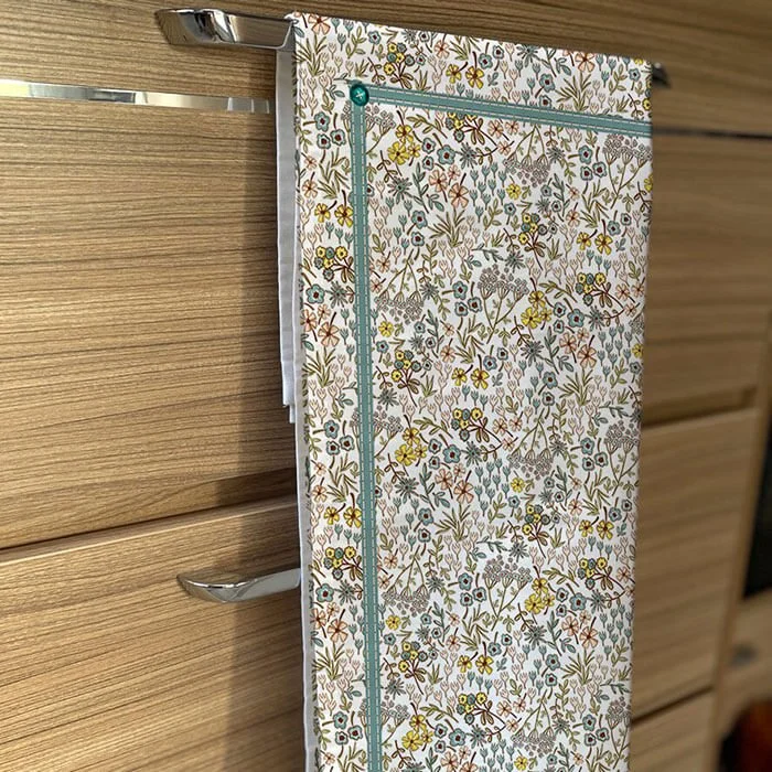 Folded ditsy floral tea towel