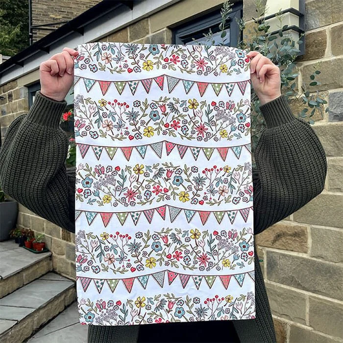 Tea towel floral bunting holding.jpg