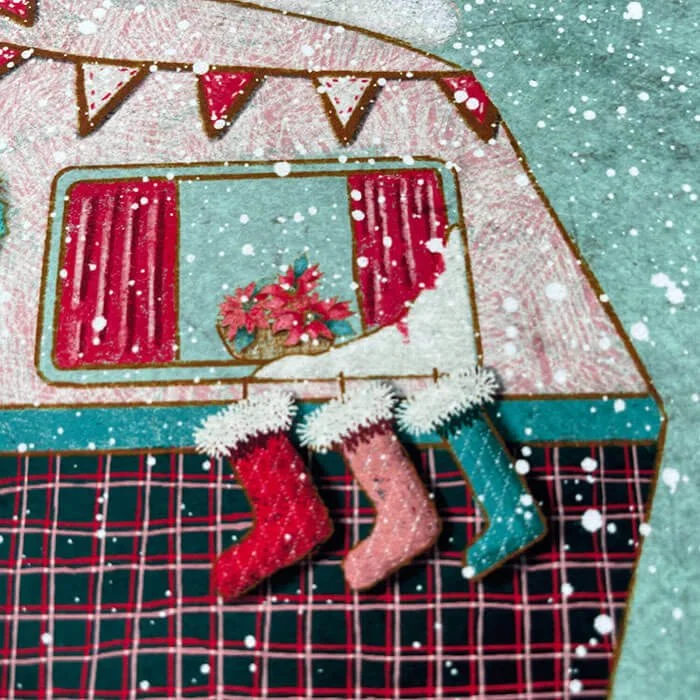 Christmas stockings hanging on caravan wall art