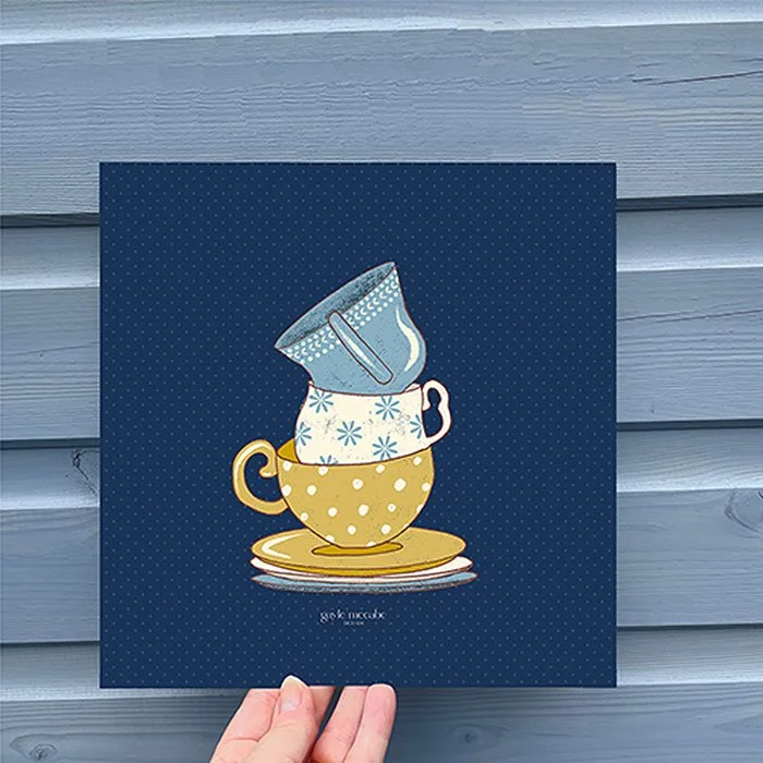 Teacups stacked on saucers wall art