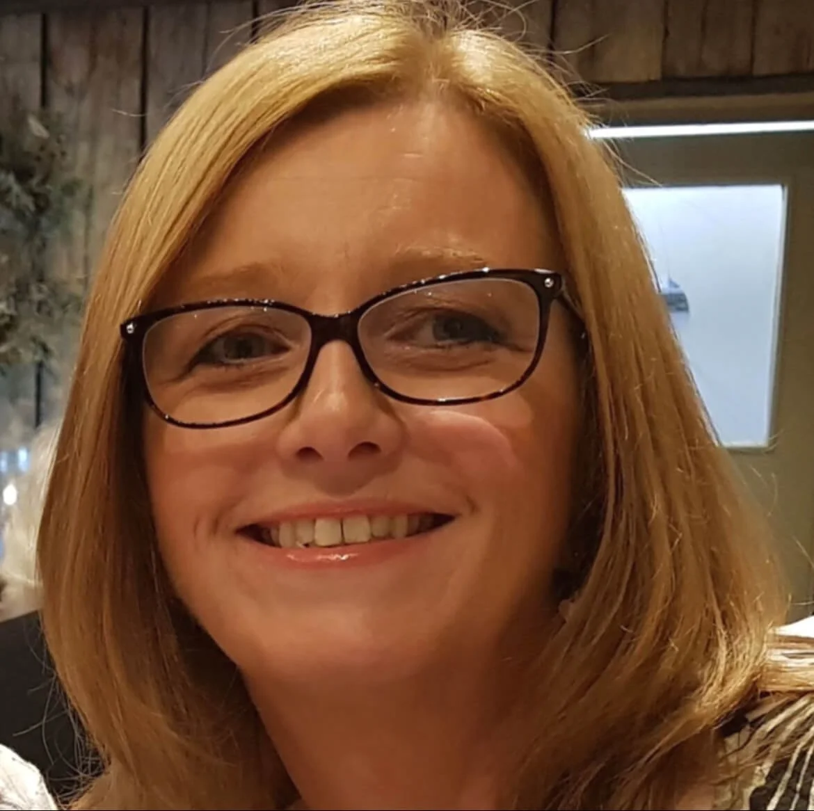 A close up image of Gayle McCabe. Medium length blonde hair with glasses.