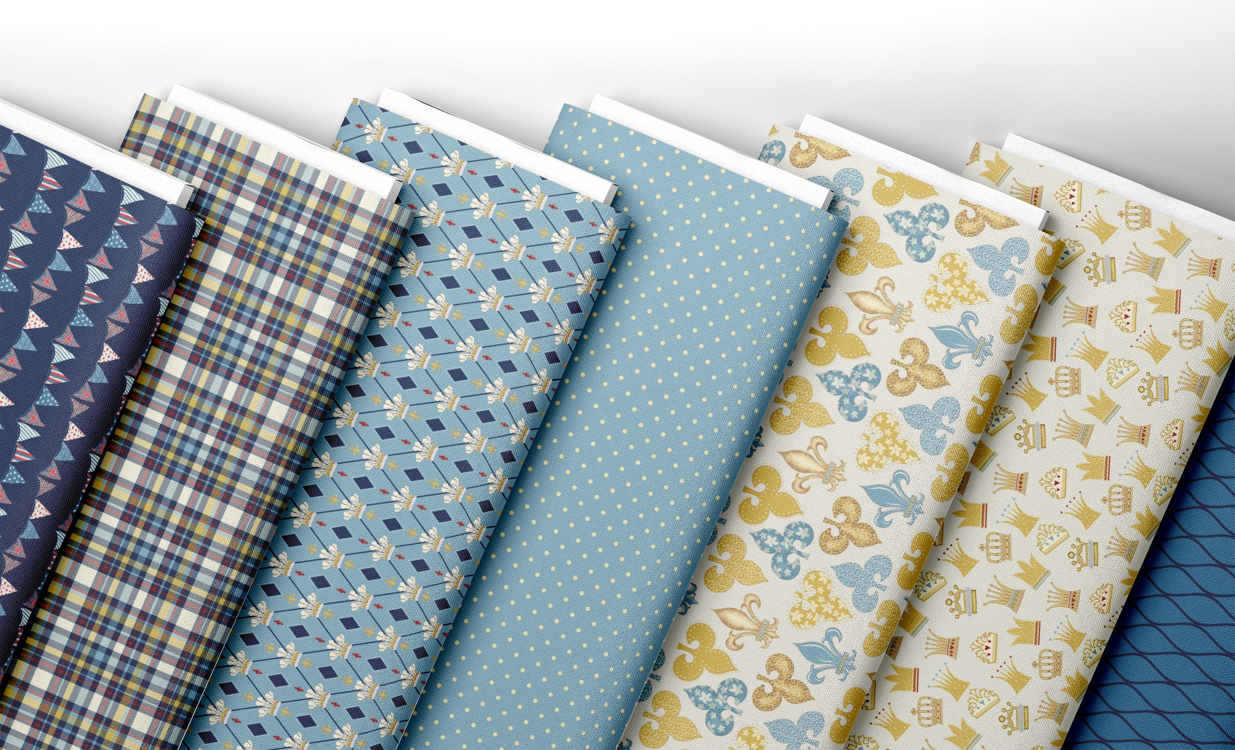 Bolts of fabric in shades of blue and cream