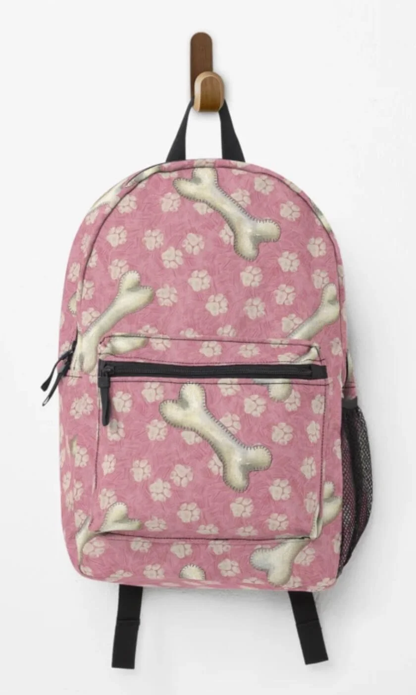 Pink dog bones rucksack with paw prints.