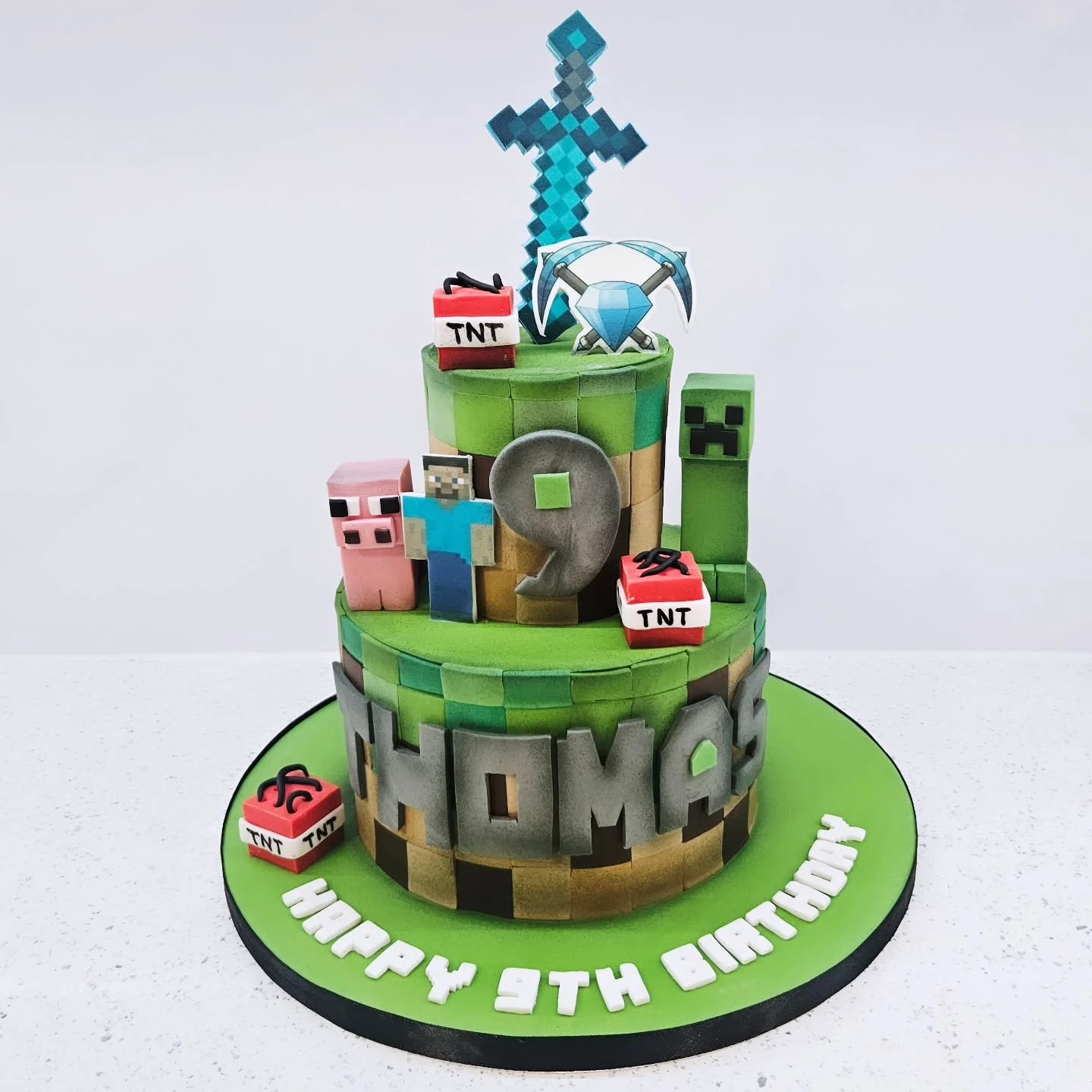 Minecraft cake for Thomas.

Cakes are made for individuals and even if you don't order yourselves, sharing and liking our posts will help us to grow as a business ❤️❤️ it's free to do and your supporting a small independent business at the touch of a