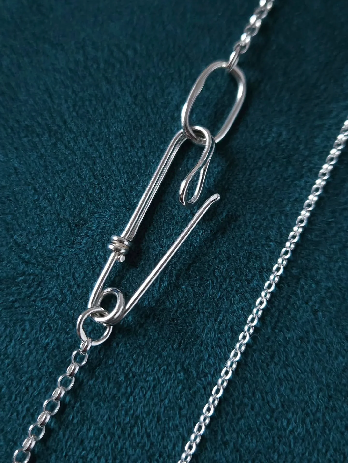 This Safety Pin necklace has been handcrafted in my Northern Ireland studio using traditional jewellery making techniques and recycled sterling silver.

A sophisticated contemporary design with an edge.

Wear it as a striking pendant, or even hang yo