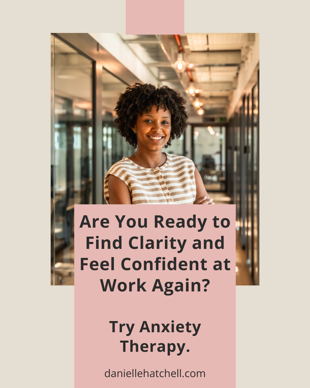 A woman at work with her arms crossed over her chest smiling confidently. Danielle Hatchell, LCPC offers anxiety therapy maryland for high-achieving working professionals.
