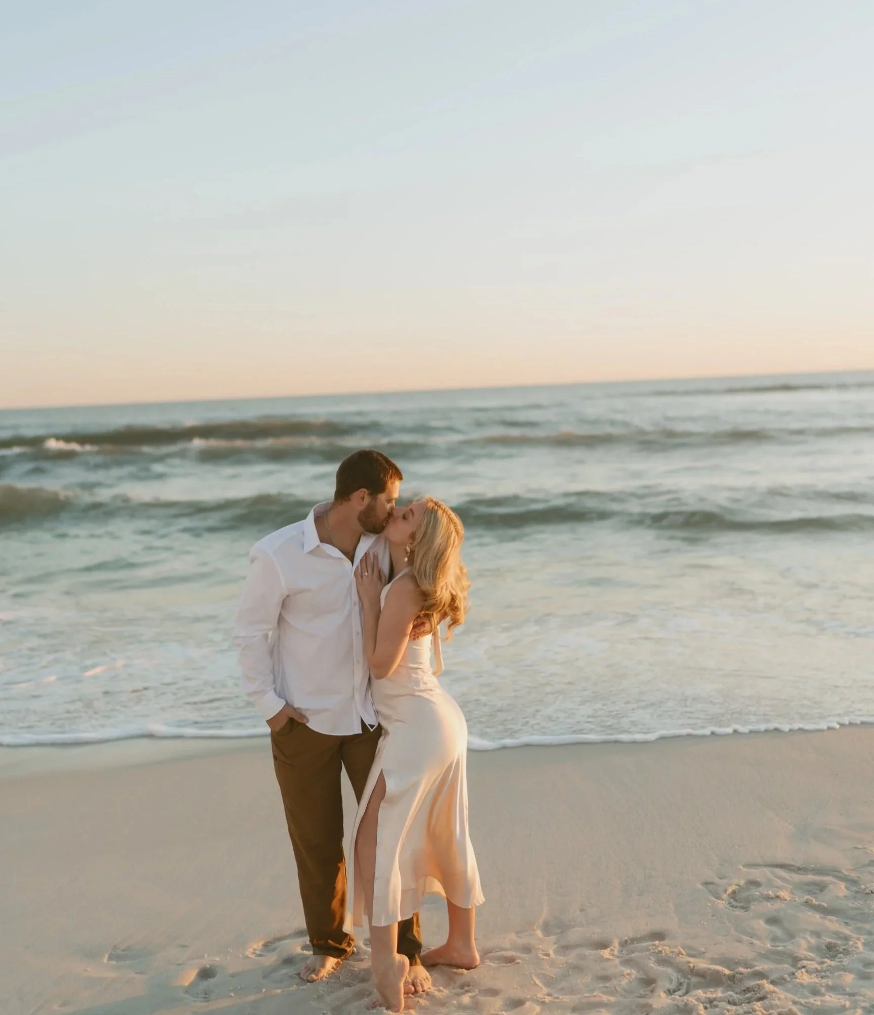 beach sunset engagement session with couple