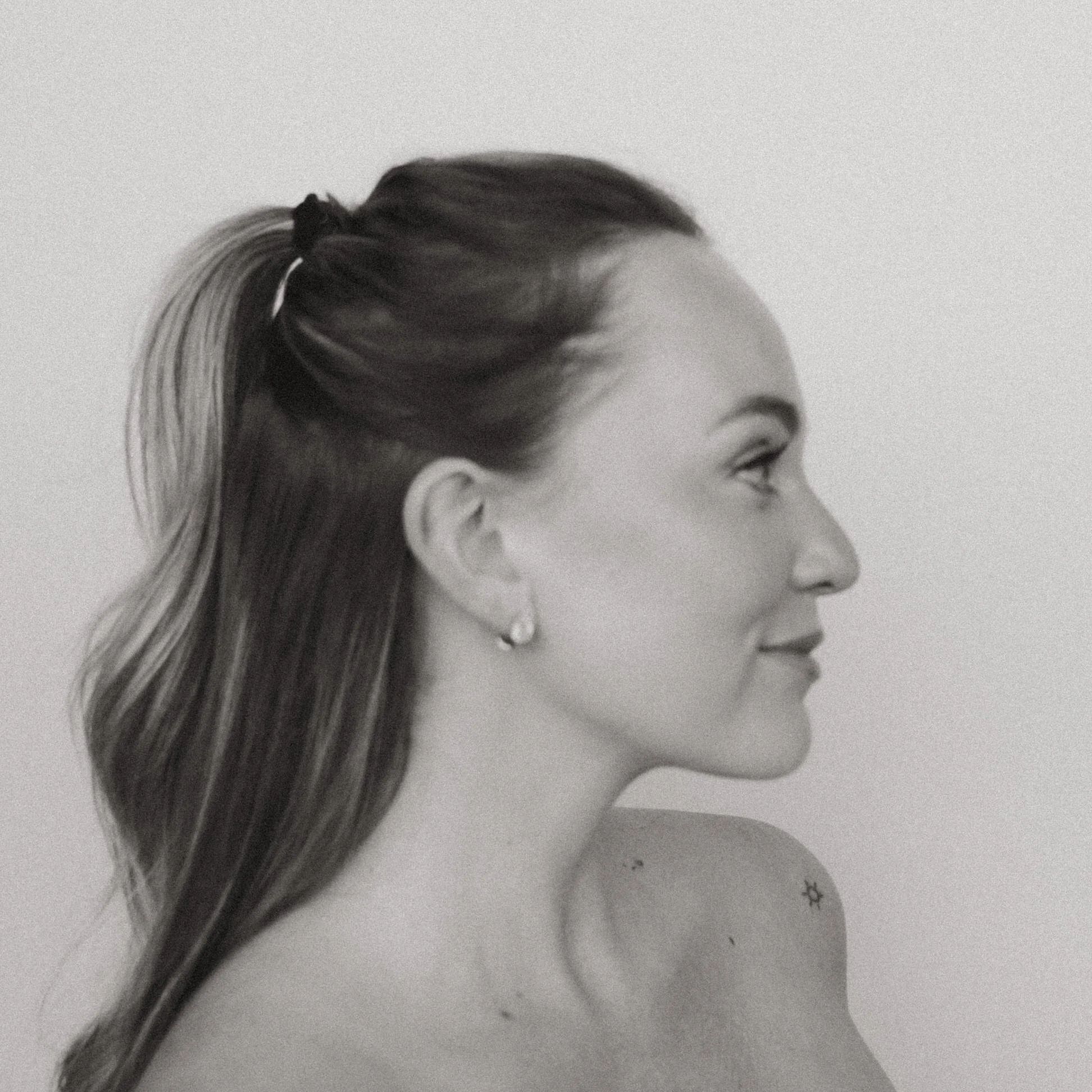 side portrait of maddie nichole photographer