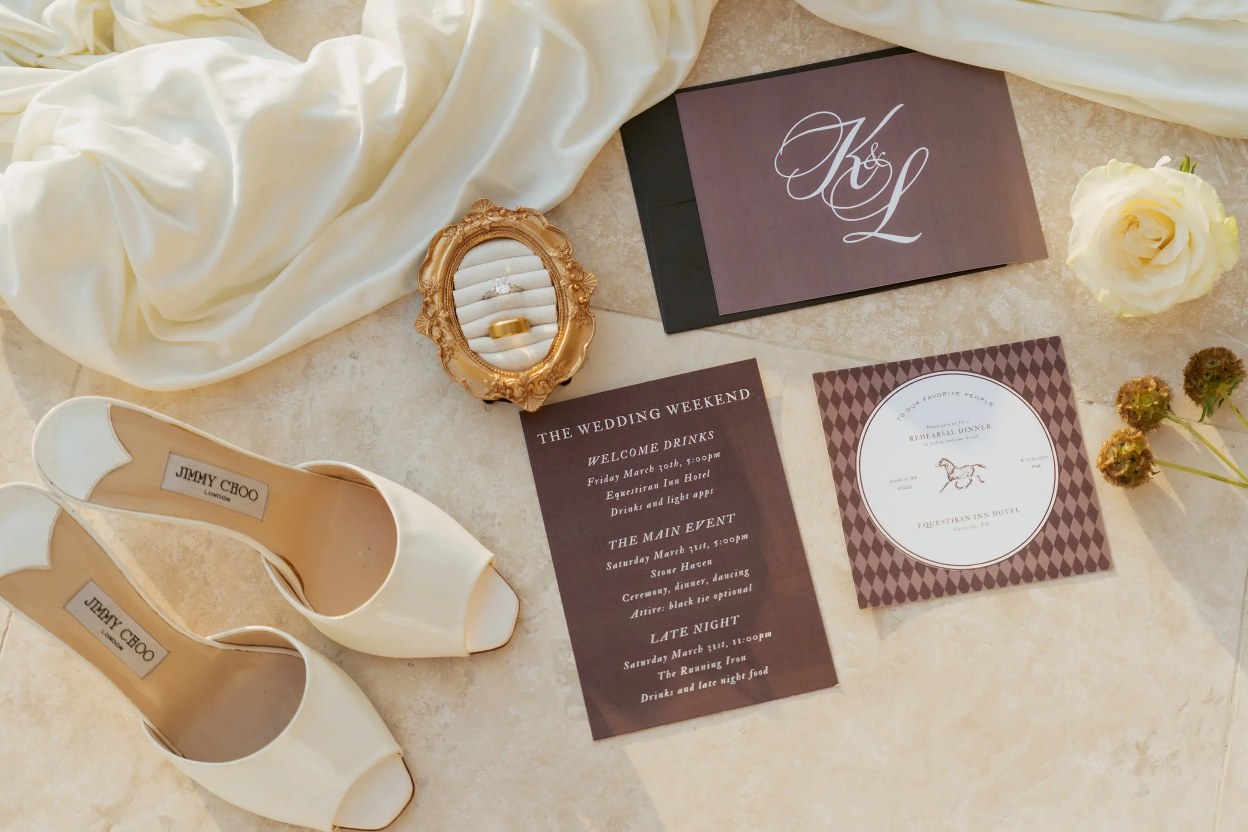 Wedding day details shot of jimmy choo shoes, jewelry and stationery