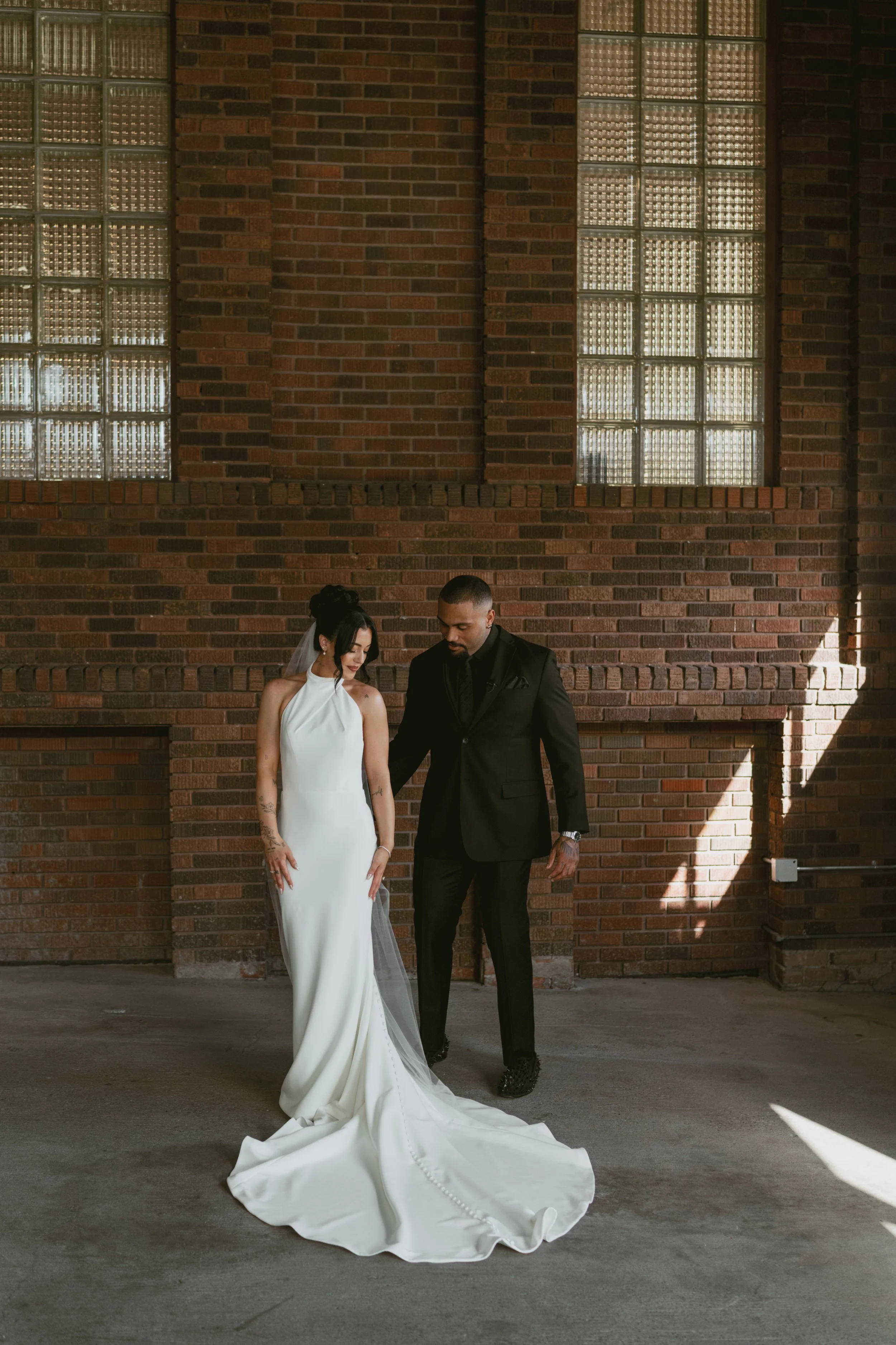  Bride and groom during first look on wedding day, groom looking at bride for the first time admiring how beautiful she looks 