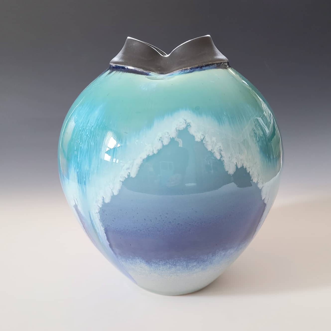 Meet Ms. Atlantis. It is said their was two waterfalls on the island, captured in her glaze. 
.
.
.
.
.
.
.
.
.
.
.
.
.
#puzzpottery #porcelainart #handthrownpots #porcelainpottery #handmadevase #ceramicartist #vases #functionalpottery #bluepottery #