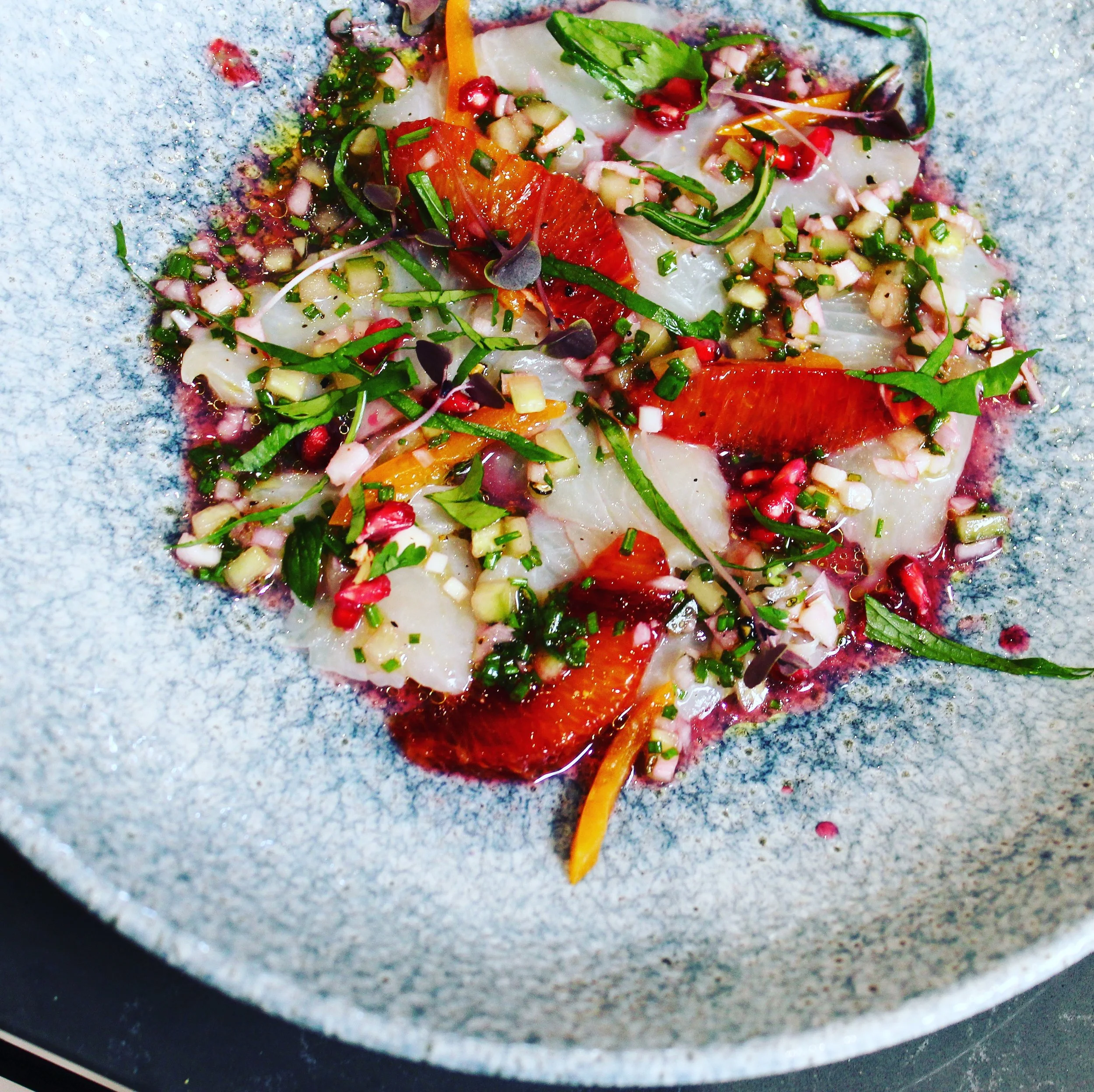 Crudo of hiramasa kingfish, pomegranate, blood orange and mint. 