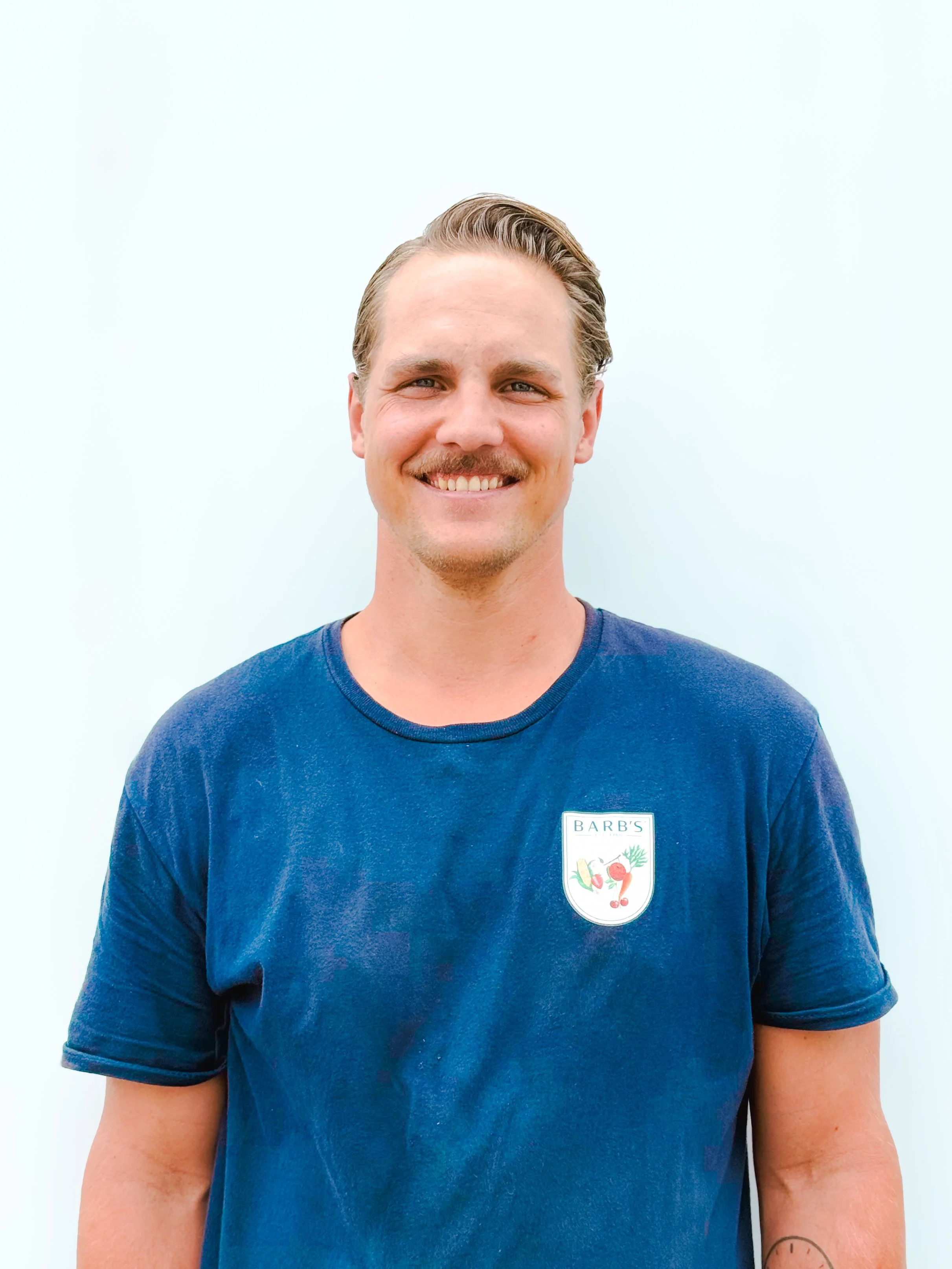DEREK VOS -
President of Barb's™, was surrounded by Steve and Barb Vos' passion for local produce since the age of 3, being mentored in customer service, hard work, and fresh food. Having graduated with honours from Laurier's business program, Derek