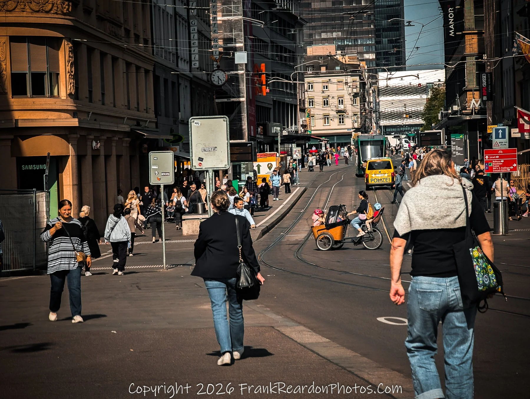 “Urban Pulse” The streets hum with movement and light, a portrait of Basel’s modern heartbeat.