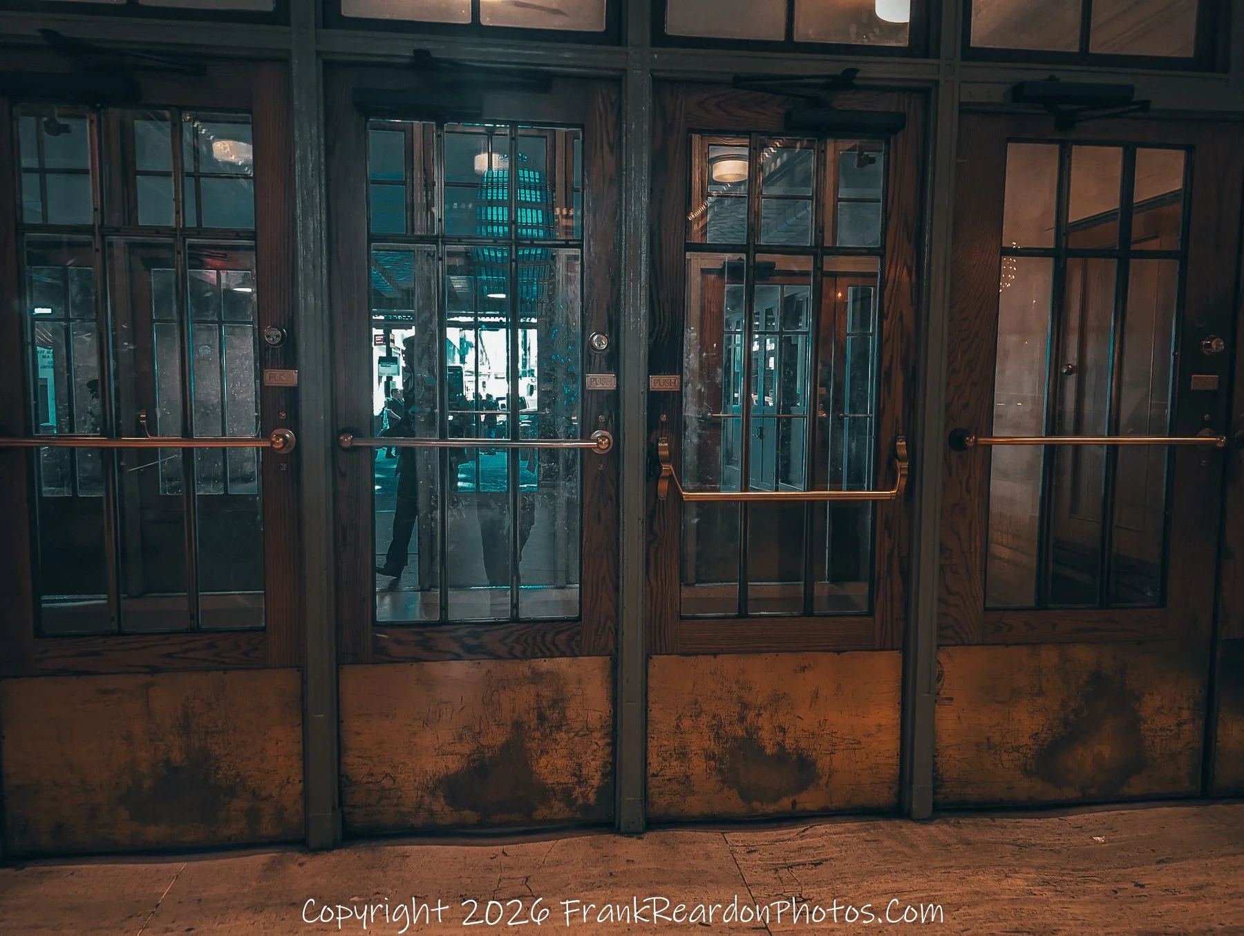 “Through the Doors: Reflections of the City”