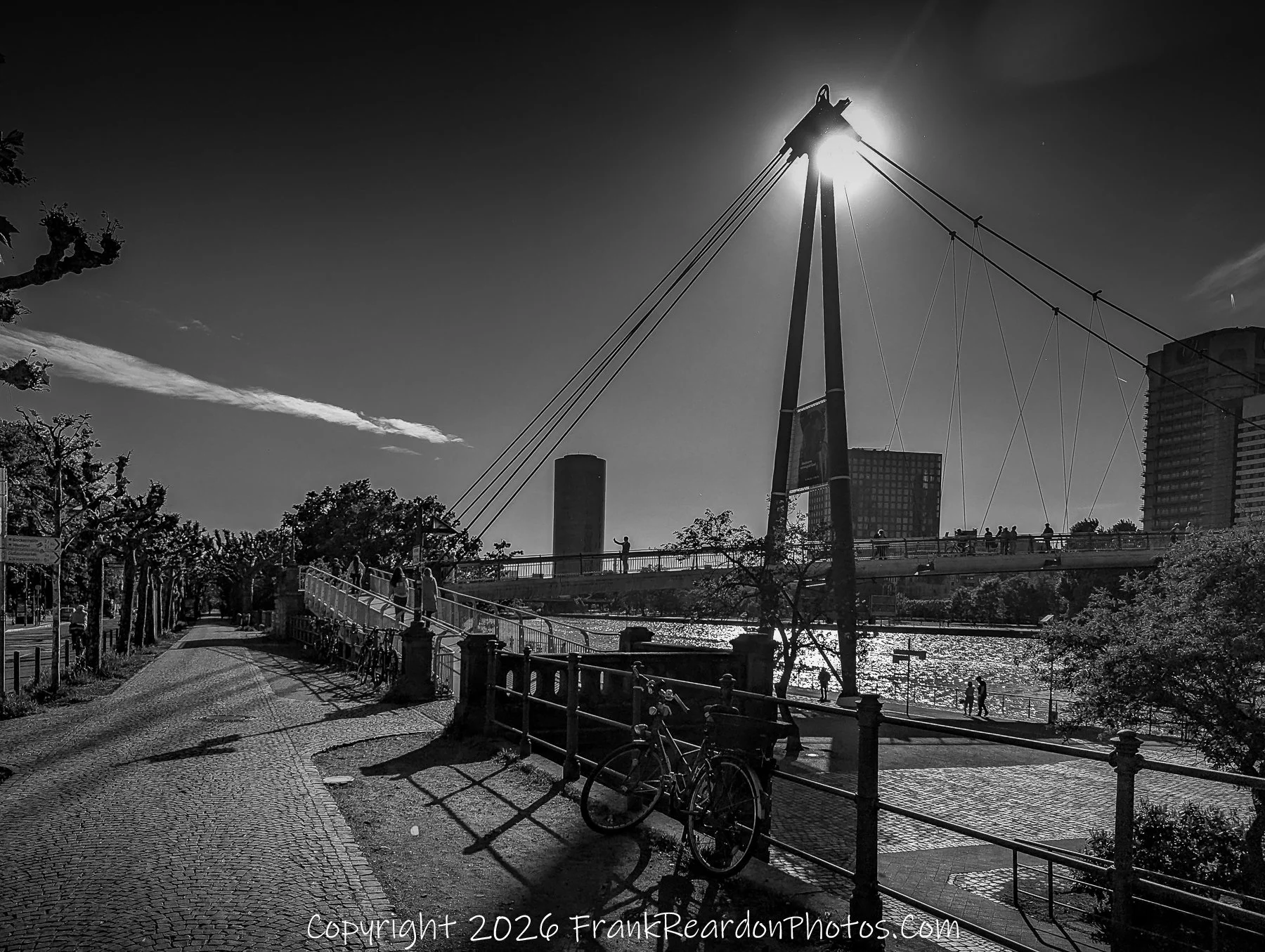 Pedestrian Bridge with Sunburst (Black & White)
“Against the Light – Bridge in Shadow”