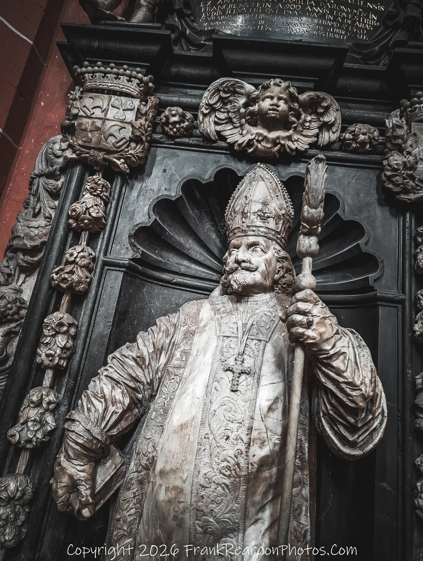 Ornate Monument with Bishop Sculpture
“Stone Legacy – Monument of Faith and Authority”