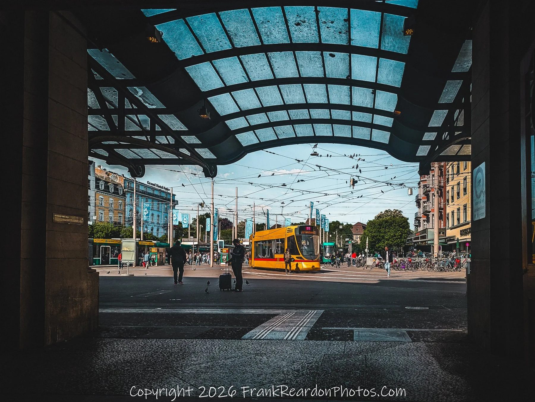 “Threshold of Motion” The station’s archway frames Basel’s trams and tangled wires, a portal to the city’s rhythm.
