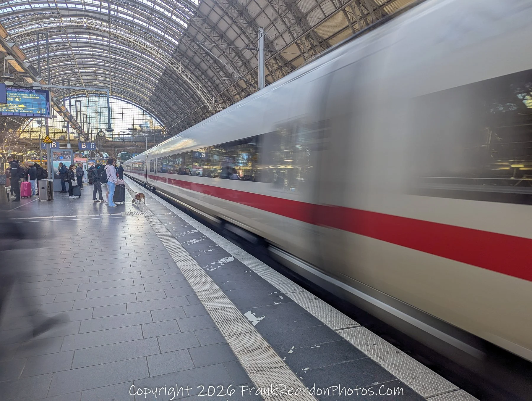 Still Amid the Rush
"A quiet moment in Frankfurt as the world speeds by in streaks of steel and light."