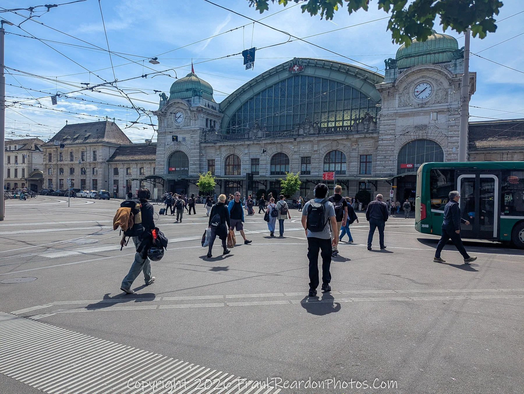 “Crossroads of Basel” The station square hums with intersecting paths, where travelers and locals converge beneath timeless domes.