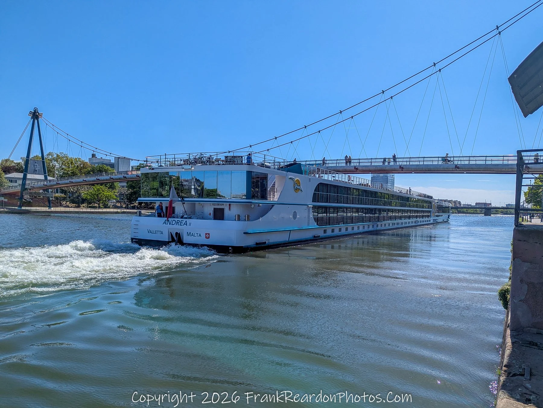 Riverboat “Andrea II” Passing Under Bridge (Wide Perspective)
“Crossing the Current – Beneath the Bridge”