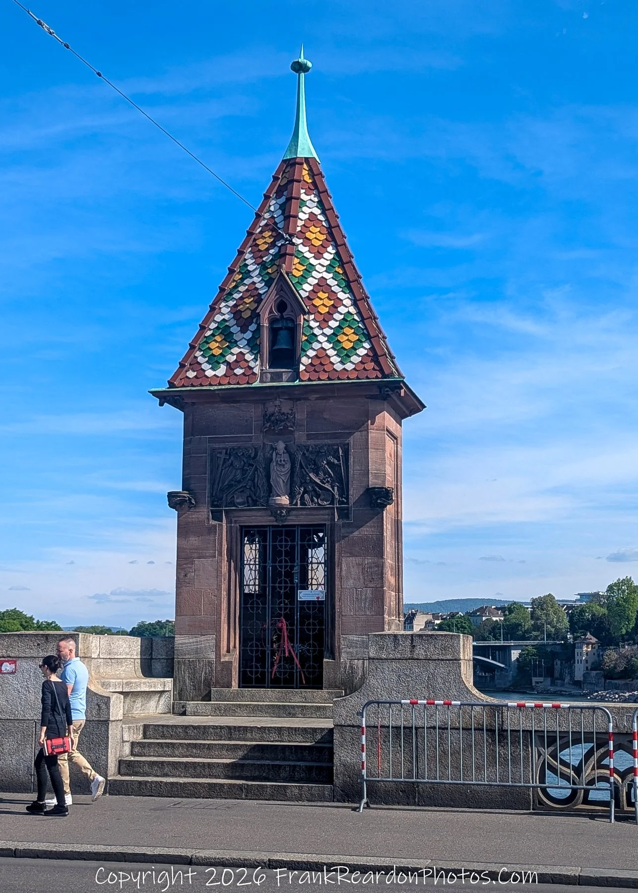 “Guardian of the Bridge” A tower crowned in mosaic tiles keeps silent vigil over centuries of crossings.