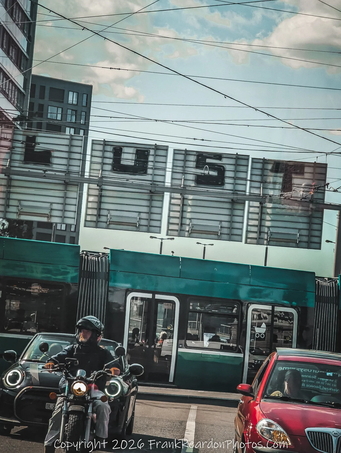 “Urban Pulse” A motorcyclist and tram share the frame under the bold sign LUST, where desire meets direction.