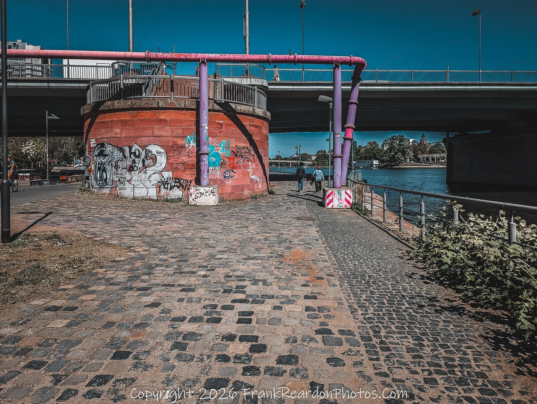 River Walk Under Bridge with Graffiti
“Urban Passages – Along the Main River”