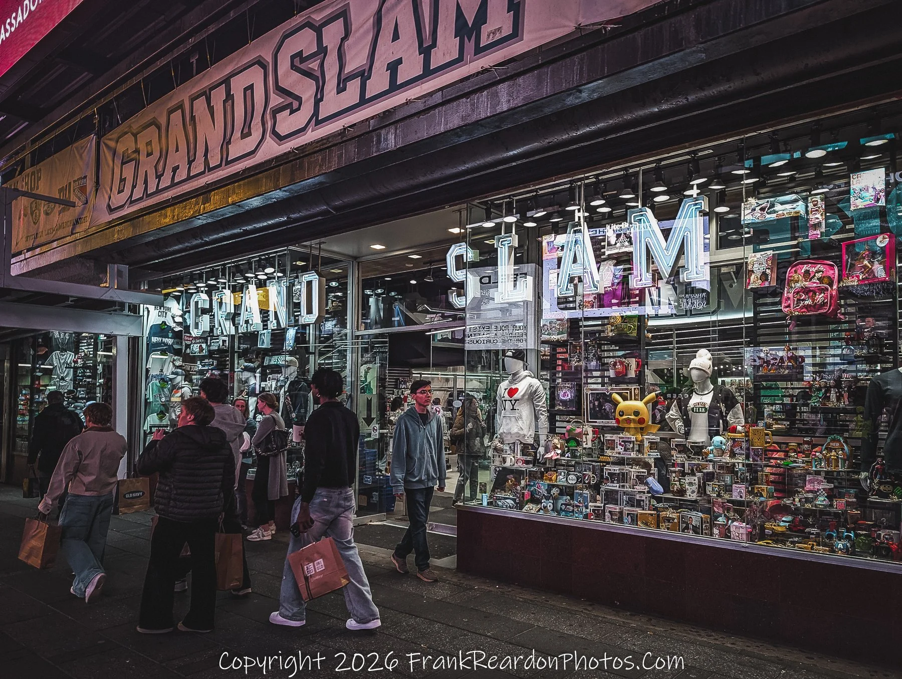 “Grand Slam: Midtown Storefront at Night”