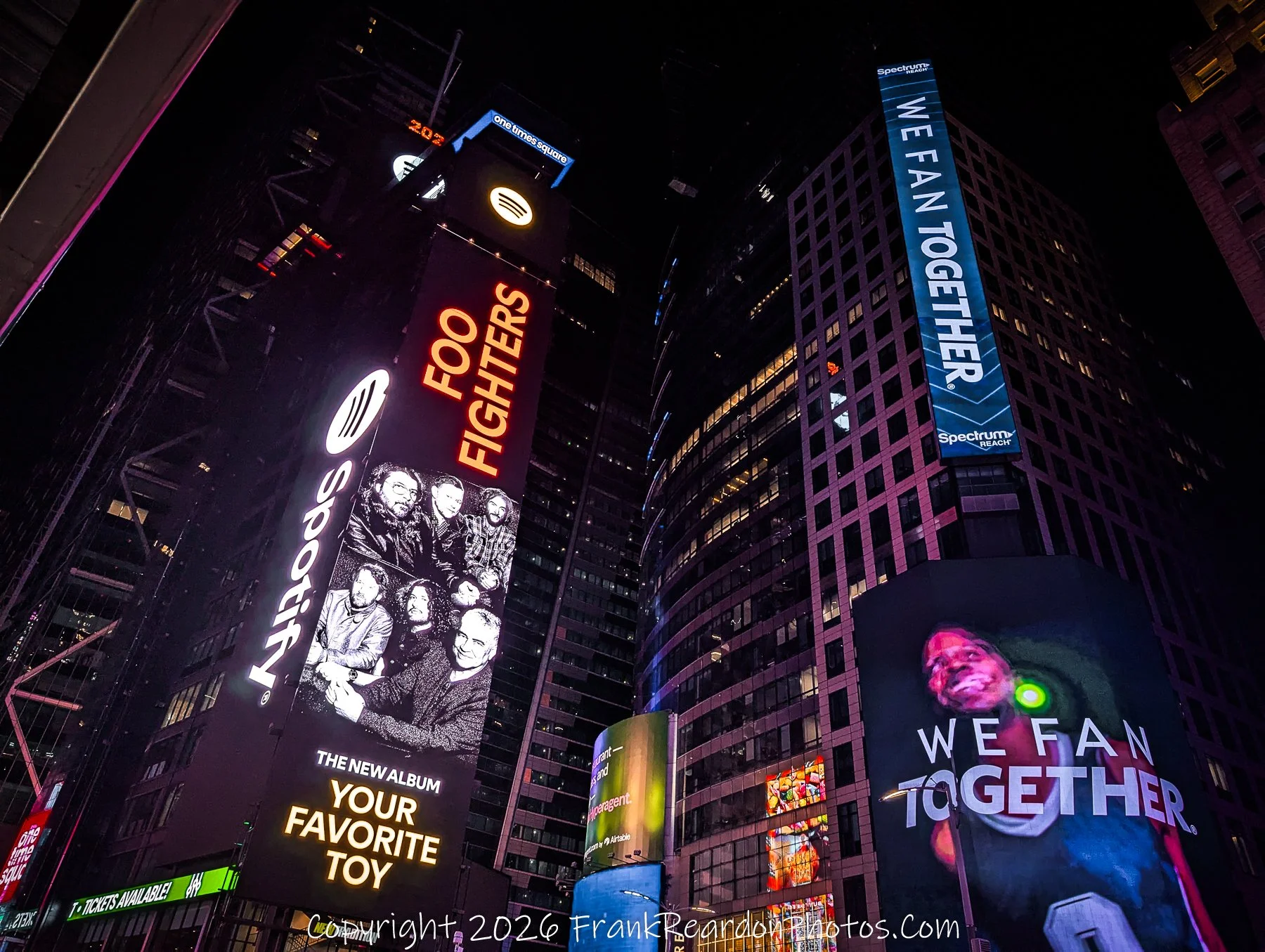 "Times Square Ascending: Lights Above the Crowd”