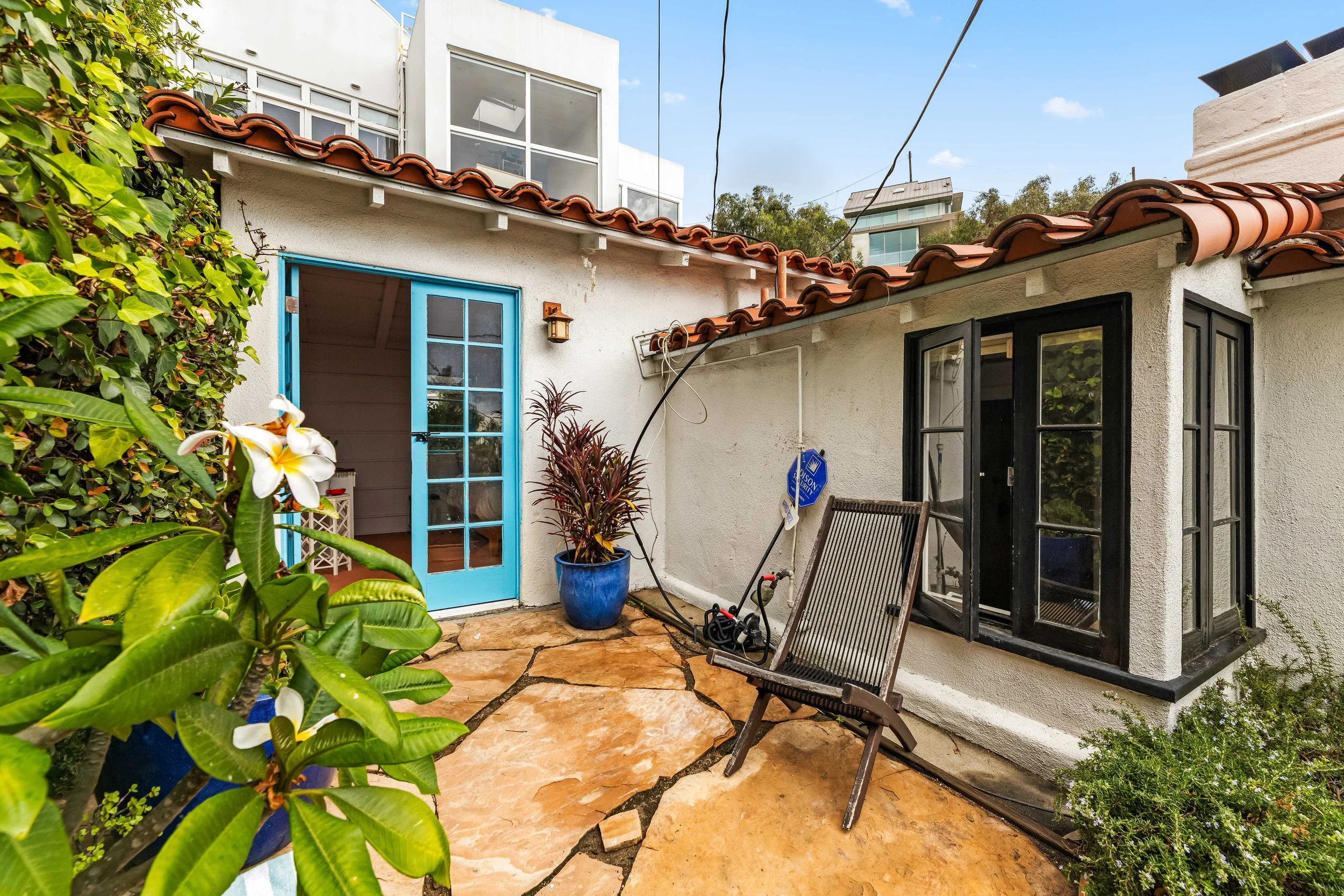 1767-n-orange-grove-ave-50-exterior-courtyard-french-doors-hollywood-hills-los-angeles.jpg