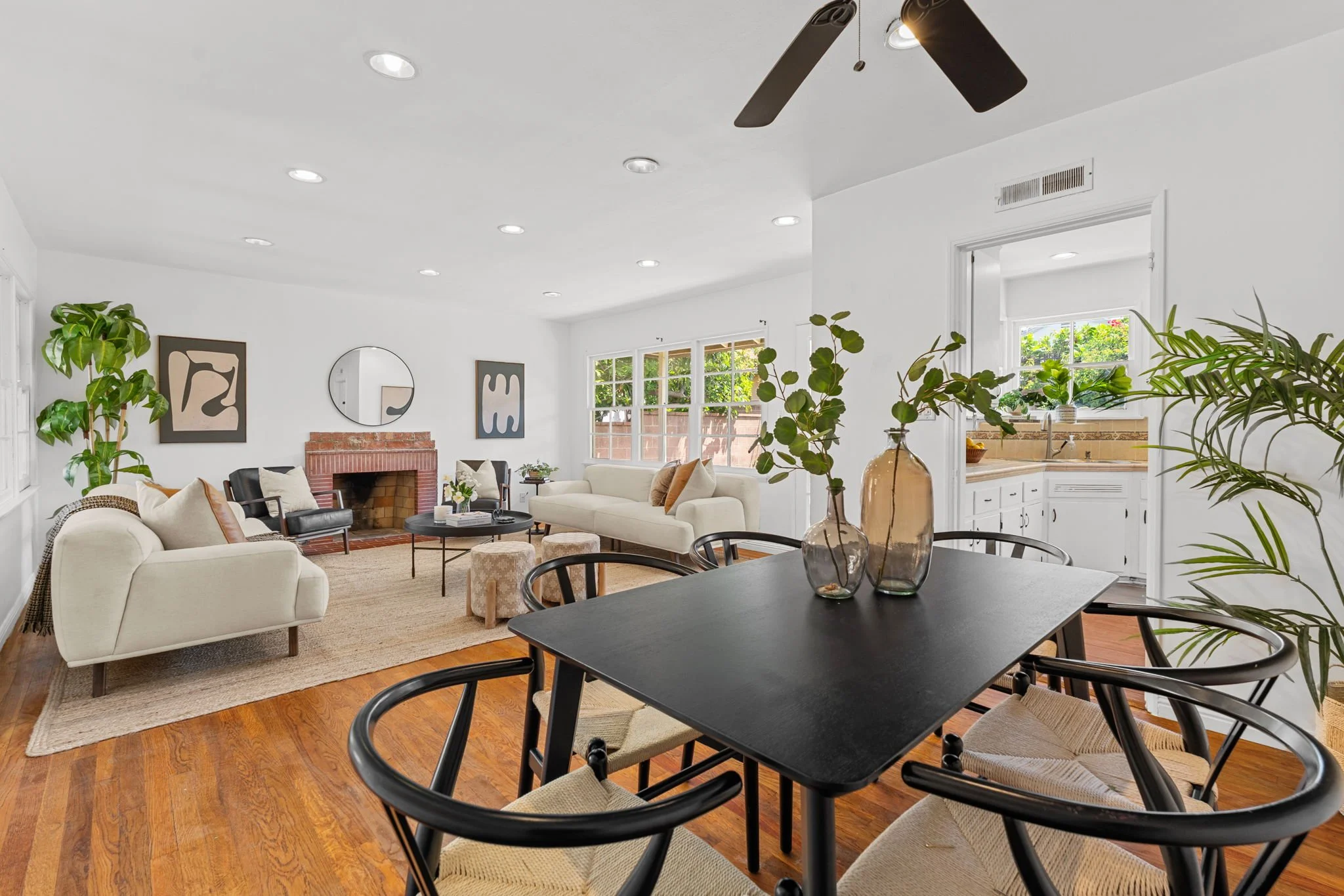 1. hawthorne-holly-park-open-concept-living-dining-room-hardwood-floors-fireplace.jpg
