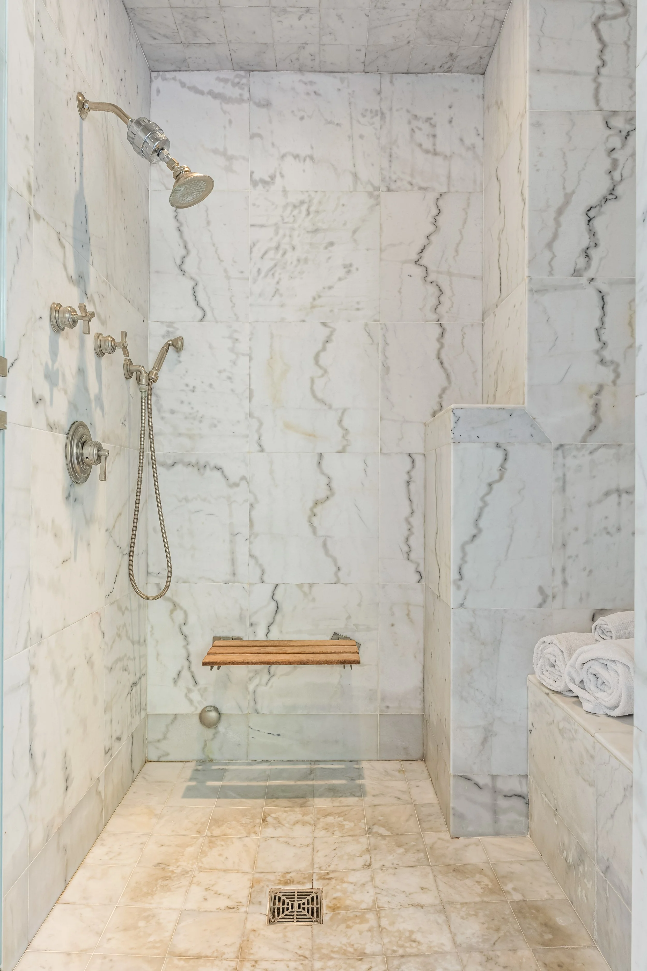 1767-n-orange-grove-ave-16-primary-bathroom-carrara-marble-shower-hollywood-hills-los-angeles.jpg