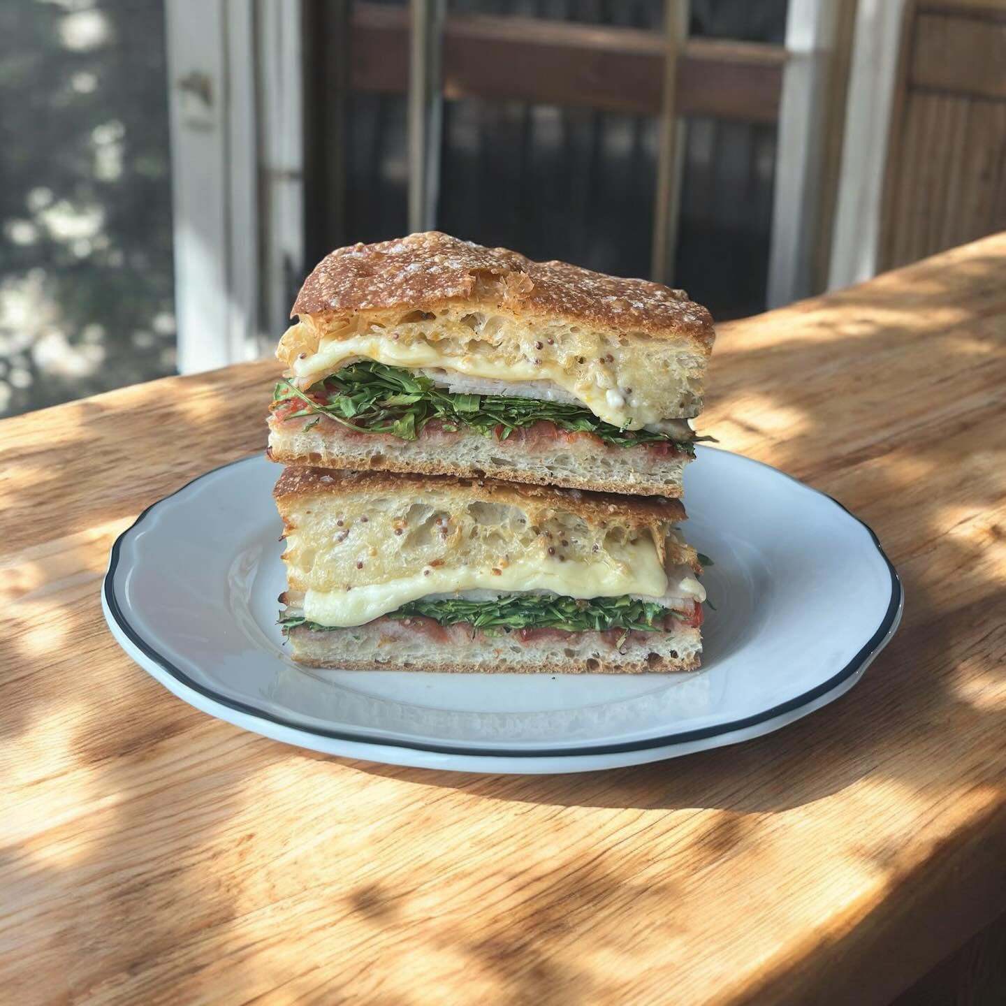 Suns out! Time for a turkey, cranberry, cheese, rocket and seeded mayonnaise focaccia. We suggest they are at their best toasted so the cheese is all oozy and paired with a beautiful coffee. Looking forward to seeing you over the weekend.