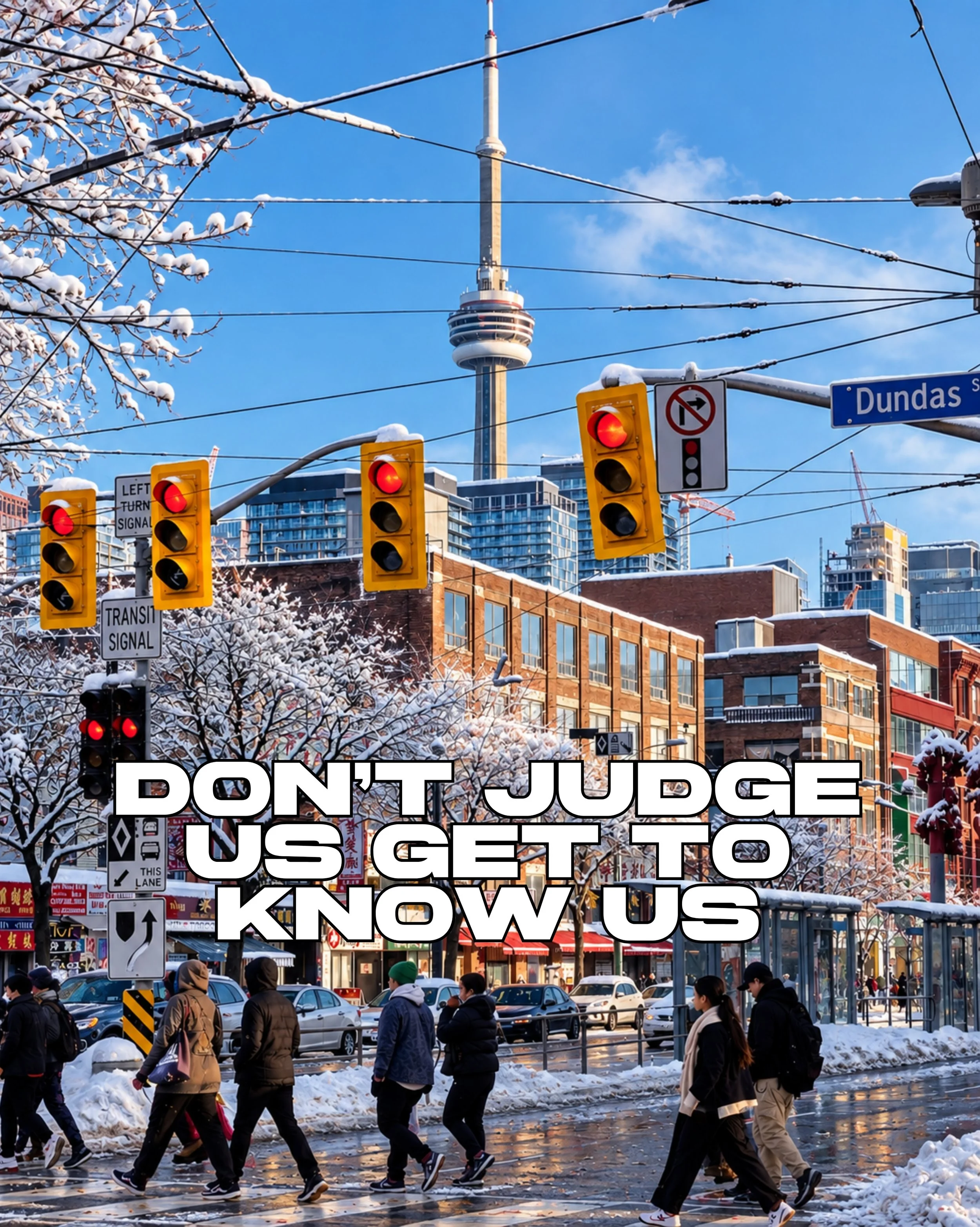 City street scene with pedestrians crossing and multiple traffic lights, Toronto CN Tower visible in the background, street sign indicating Dundas Street.