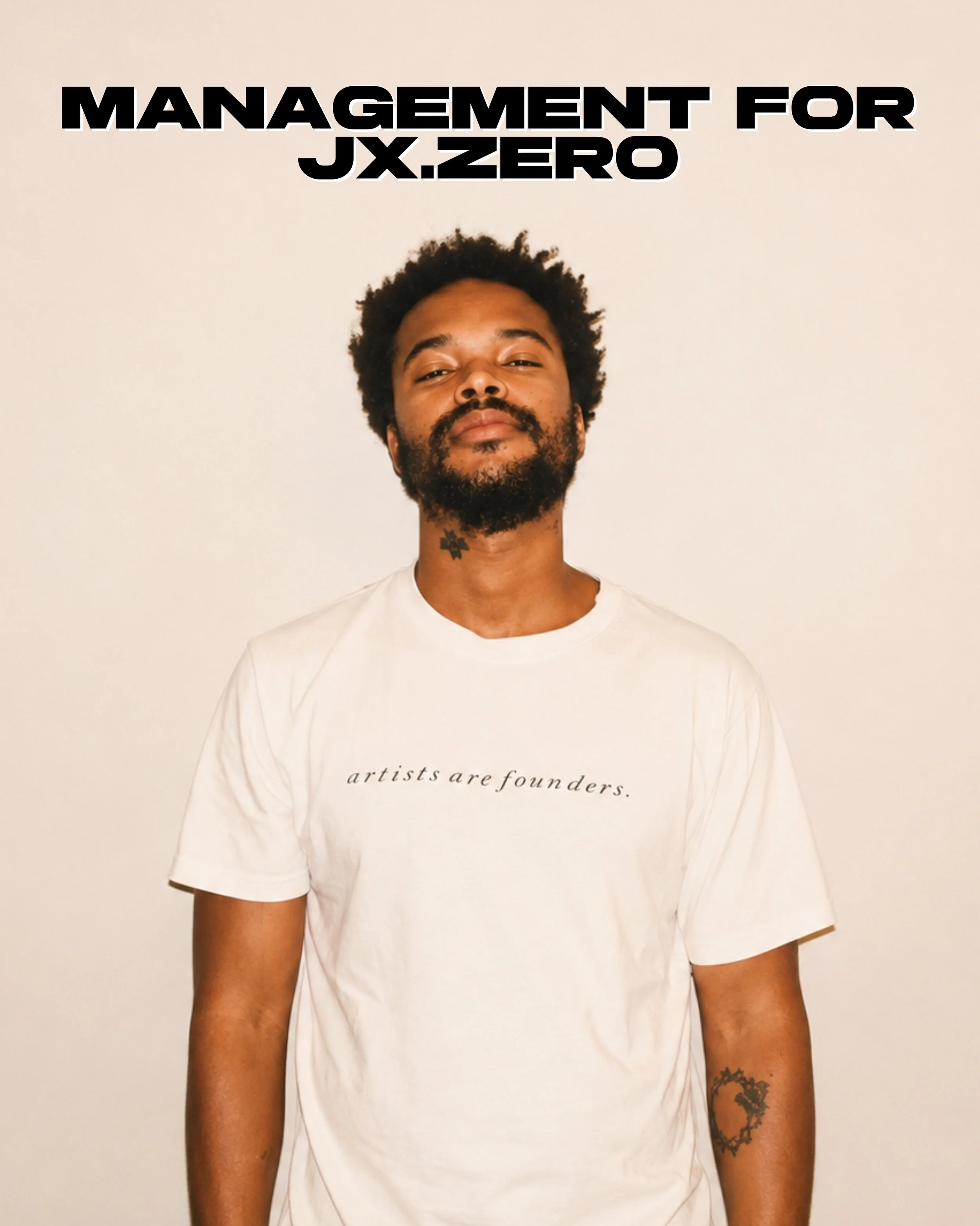 Jx.Zero with a beard and curly hair standing against a plain light-colored background. He is wearing a white T-shirt with the text "artists are founders." and has a small tattoo on his neck. His arms are visible, with a tattoo on his left forearm.