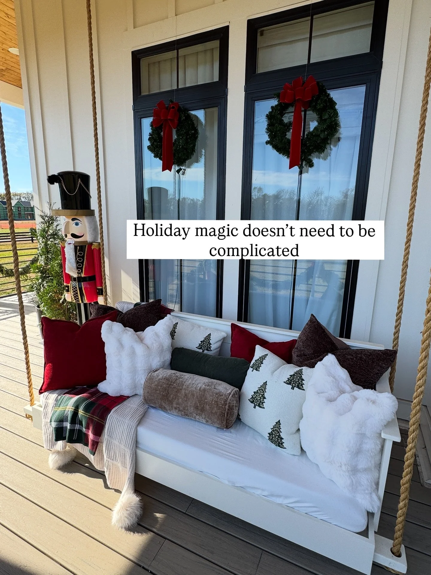 This porch was designed to welcome the season with warmth - layered pillows on the swing, garland down the staircase, and living evergreens that will grow long after the holidays.

And a very special thank you to @jennyreimold for inviting us to styl