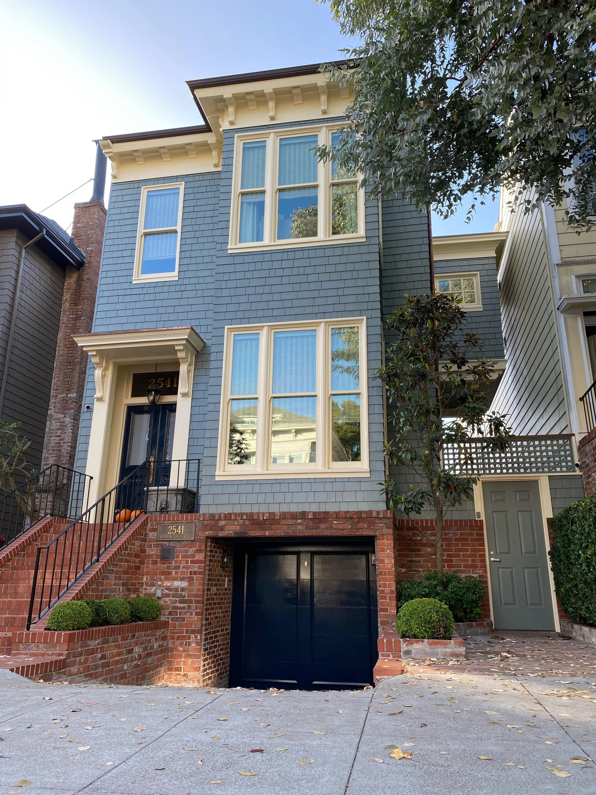 This client couldn't change his trim color so I picked the perfect color for his house. He didn't want a yellow, right?!? But he didn't want a gray exterior either. We both love the dark blue navy front door. Its not a Benjamin Moore color. Its a war